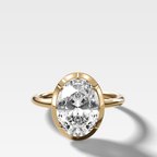 Button Back Solitaire Engagement Ring With an Oval Cut Diamond