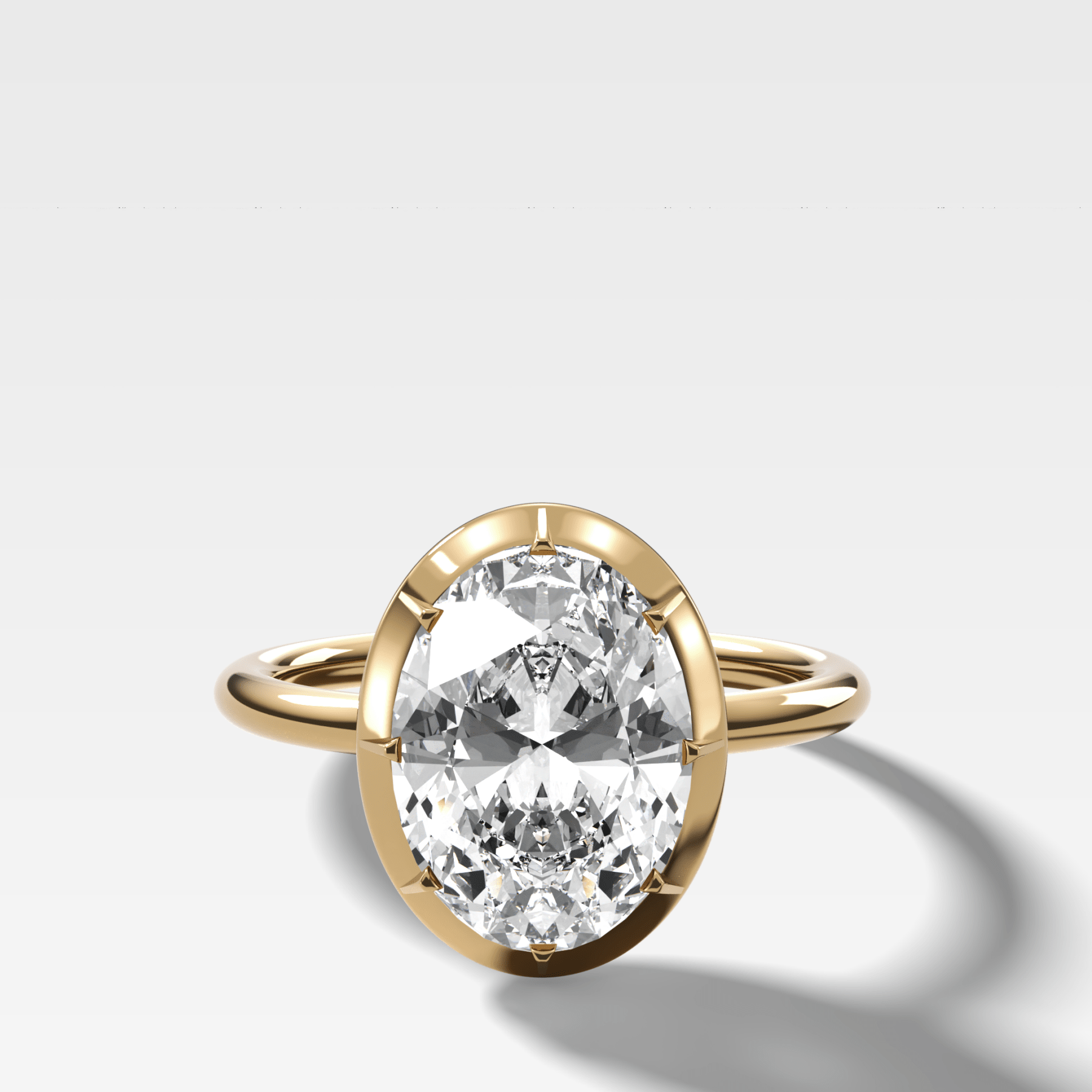 Button Back Solitaire Engagement Ring With an Oval Cut Diamond