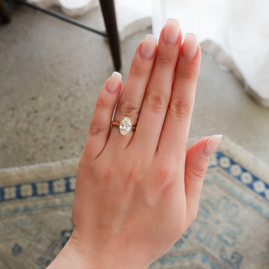 Cathedral Bezel Set Solitaire Engagement Ring with 2.54ct Lab Grown Oval Diamond