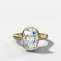Cathedral Bezel Set Solitaire Engagement Ring With Elongated Cushion Diamond