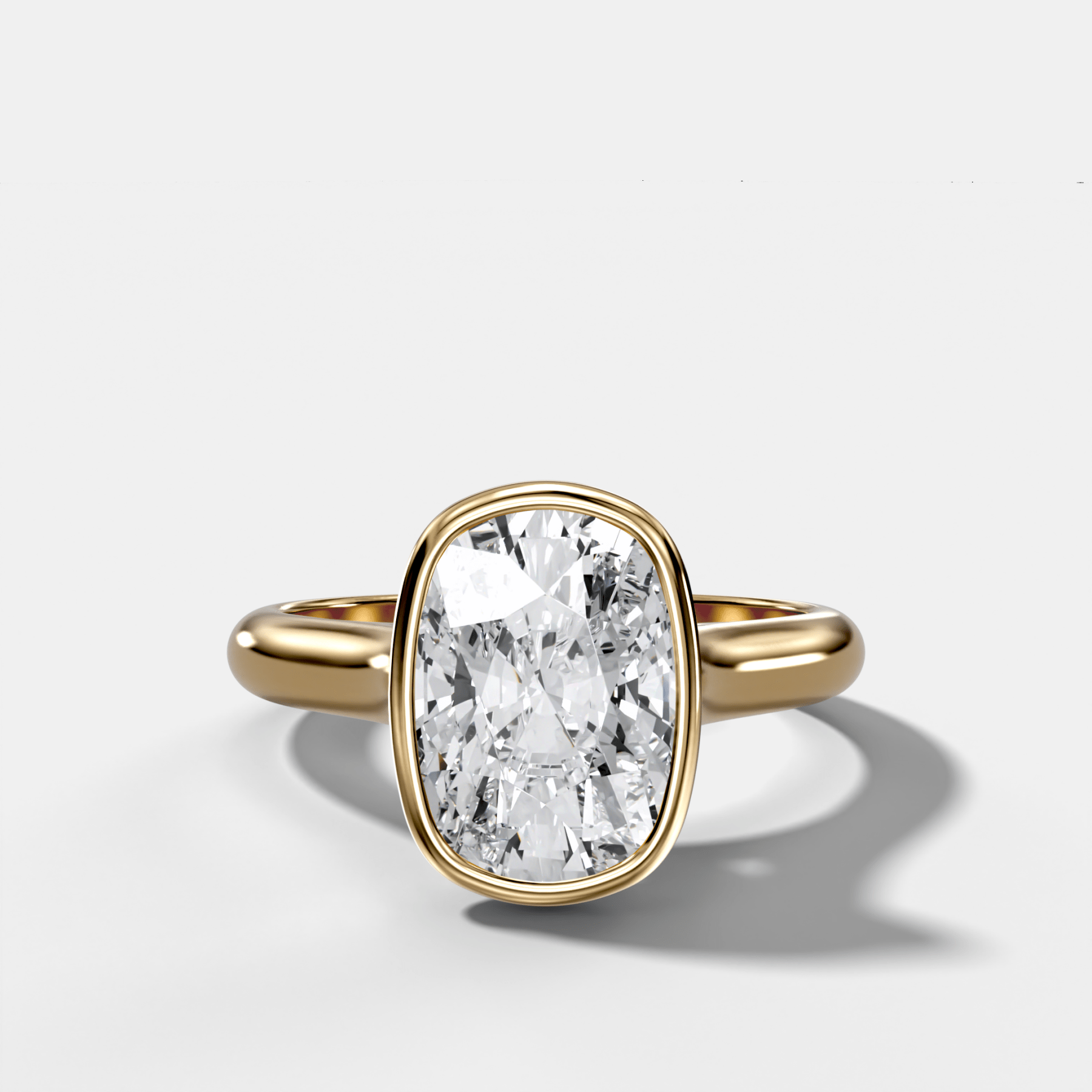 Cathedral Bezel Set Solitaire Engagement Ring With Elongated Cushion Diamond