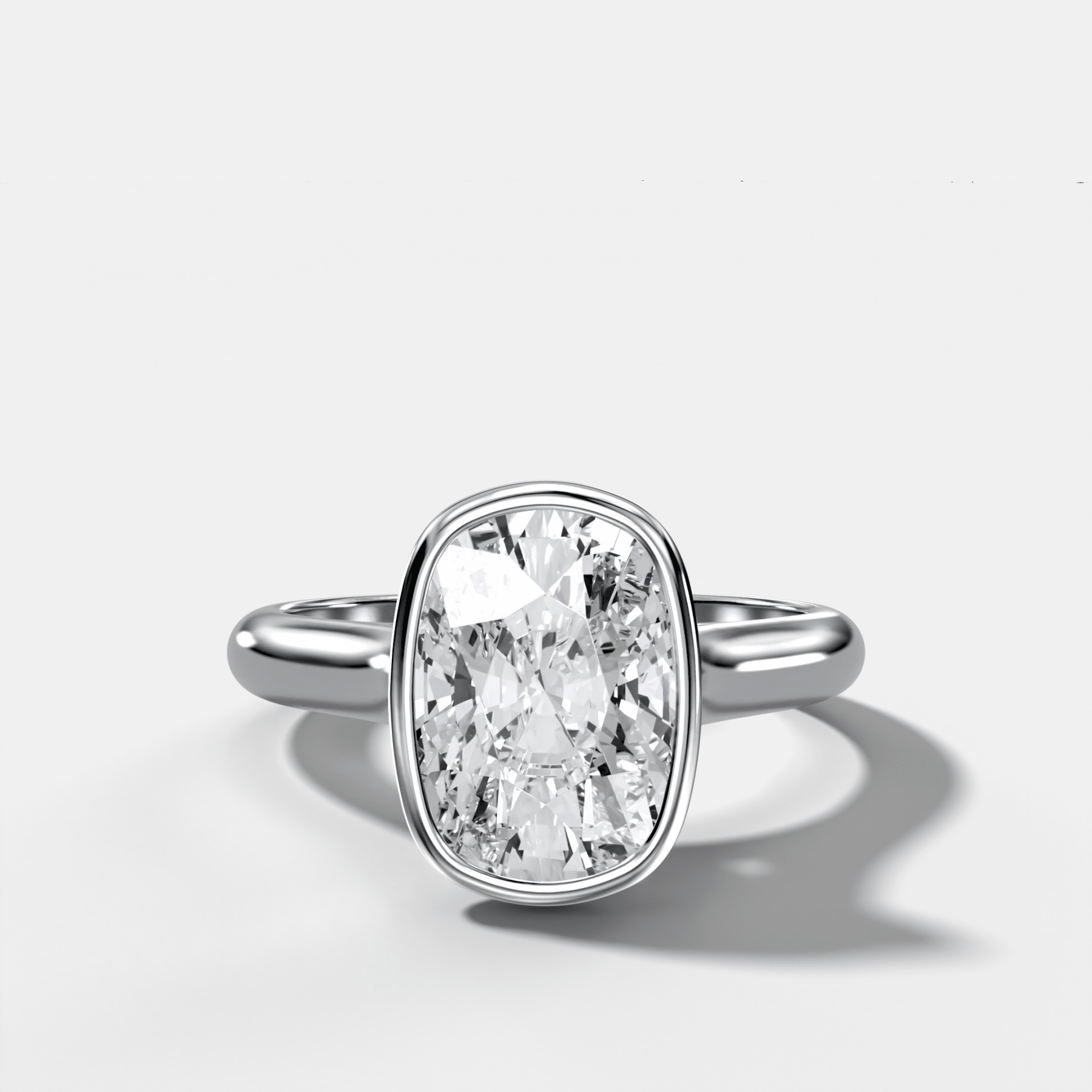 Cathedral Bezel Set Solitaire Engagement Ring With Elongated Cushion Diamond