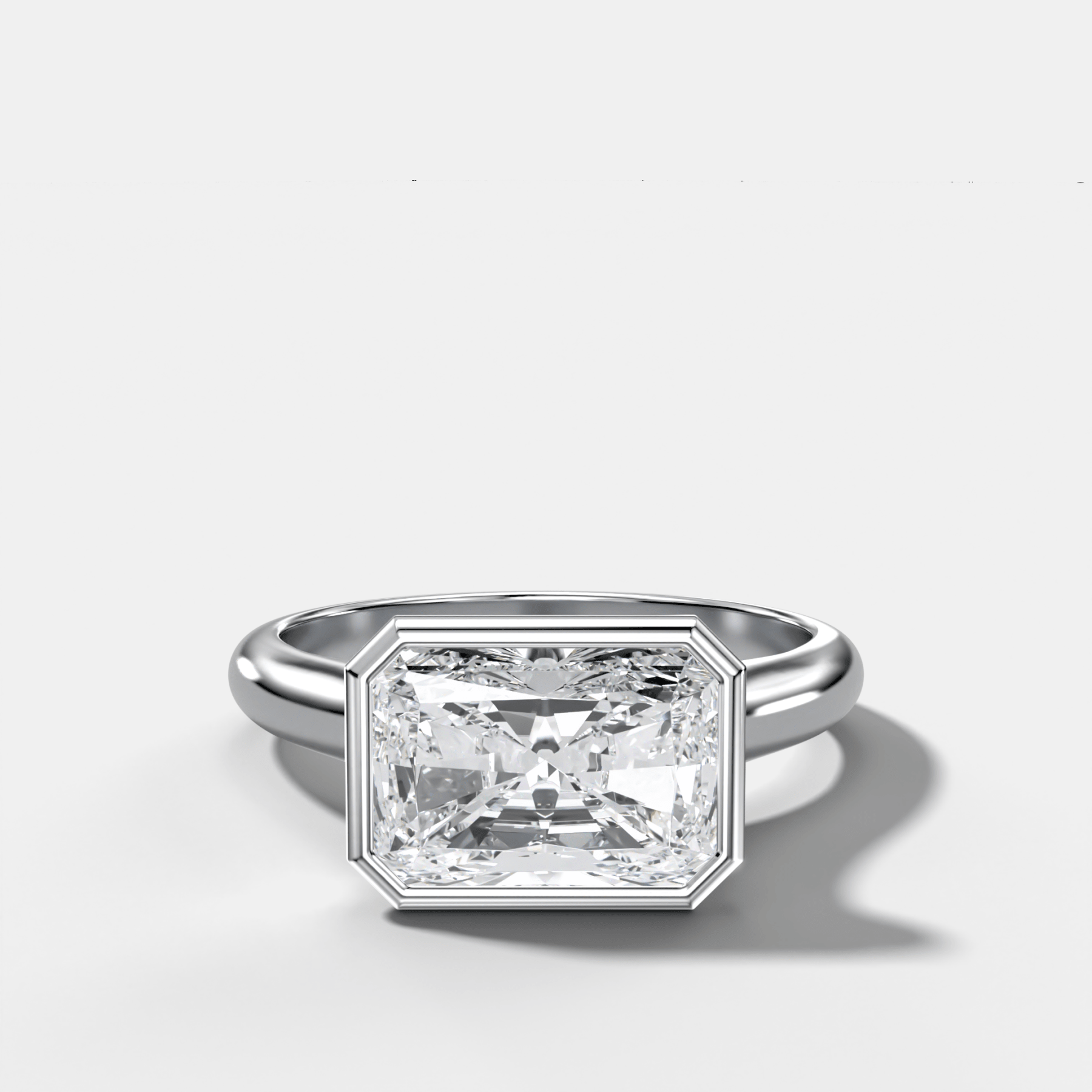 Cathedral Bezel Set Solitaire Engagement Ring With Elongated Radiant Diamond (East West)