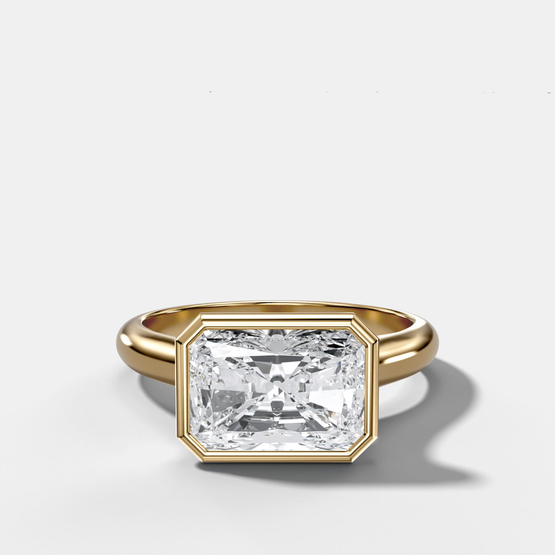 Cathedral Bezel Set Solitaire Engagement Ring With Elongated Radiant Diamond (East West)