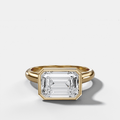Cathedral Bezel Set Solitaire Engagement Ring With Emerald Cut Diamond (East West)