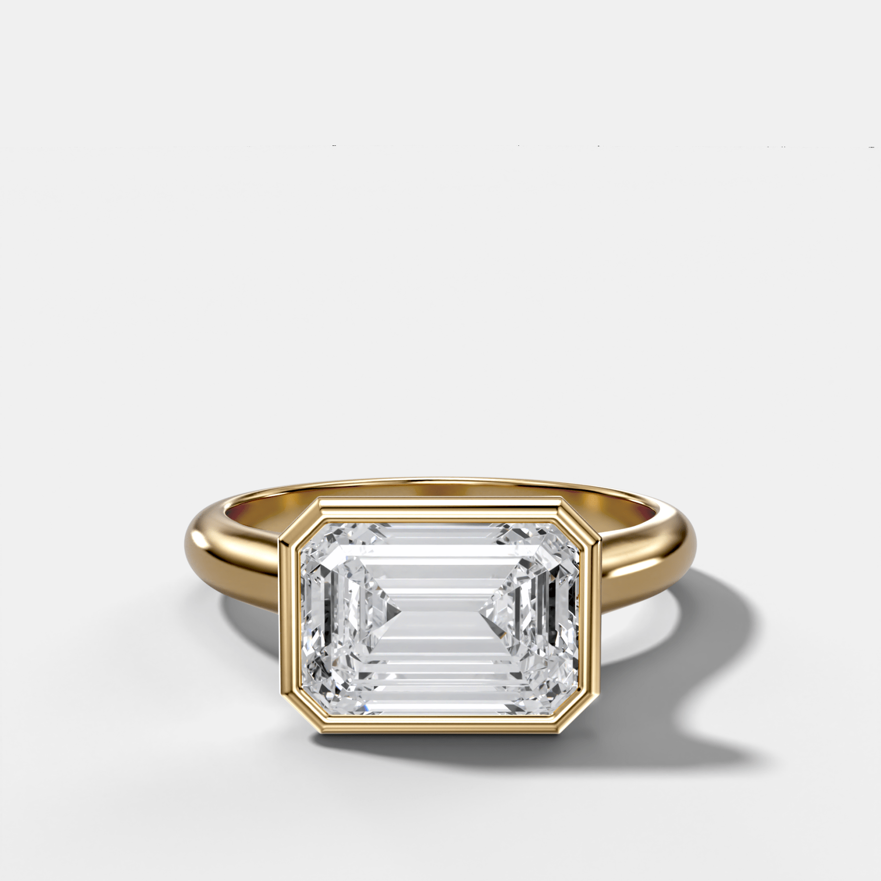Cathedral Bezel Set Solitaire Engagement Ring With Emerald Cut Diamond (East West)