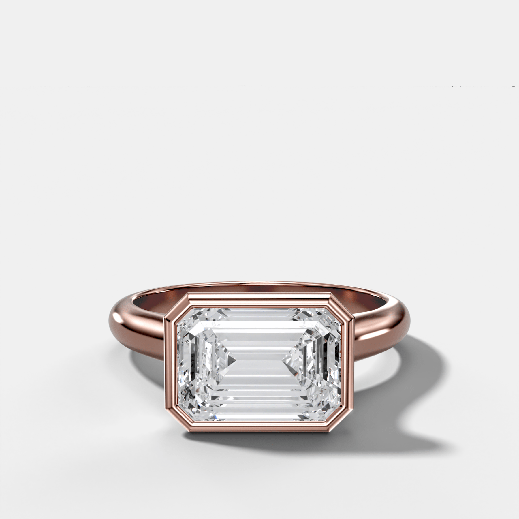 Cathedral Bezel Set Solitaire Engagement Ring With Emerald Cut Diamond (East West)
