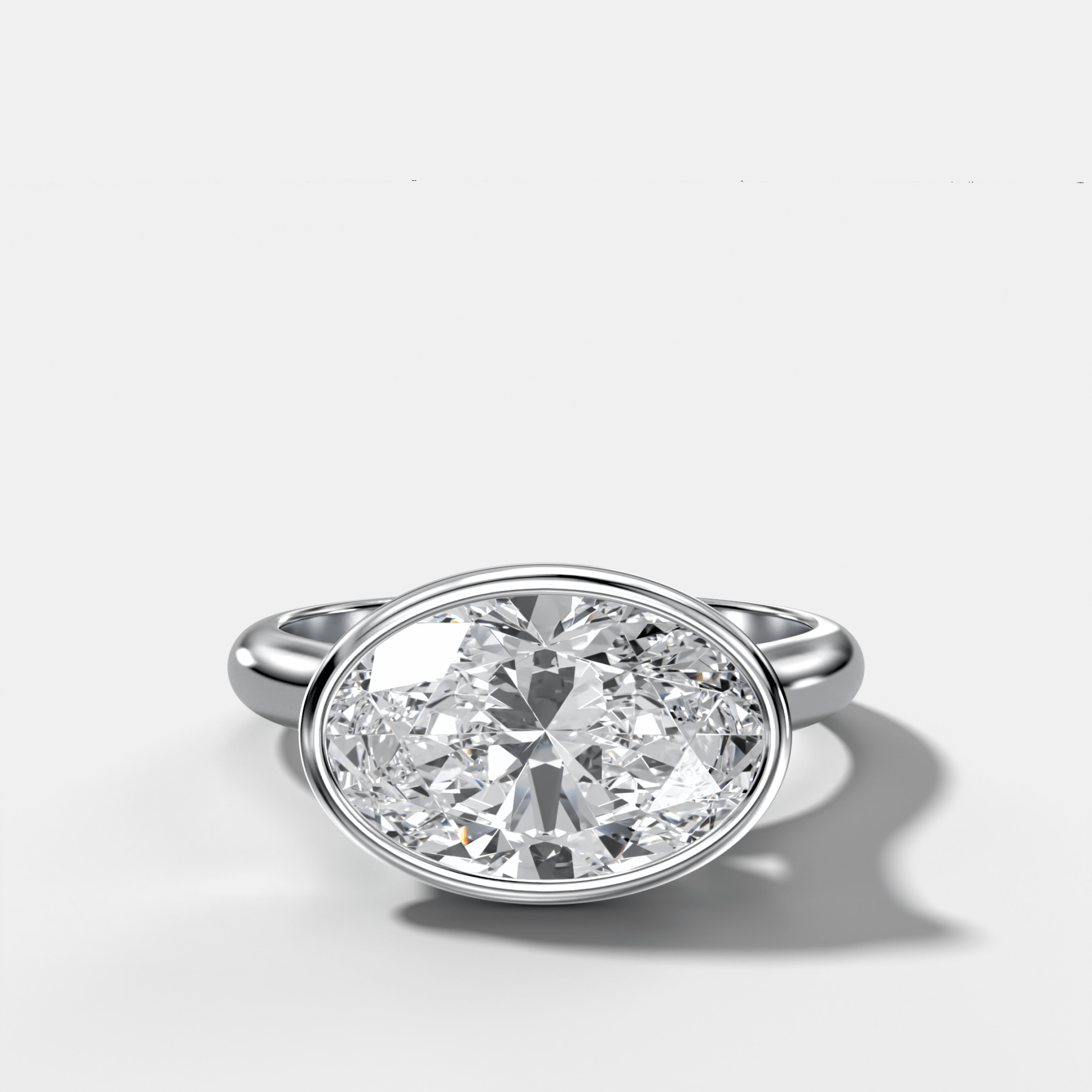 Cathedral Bezel Set Solitaire Engagement Ring With Oval Diamond (East West)