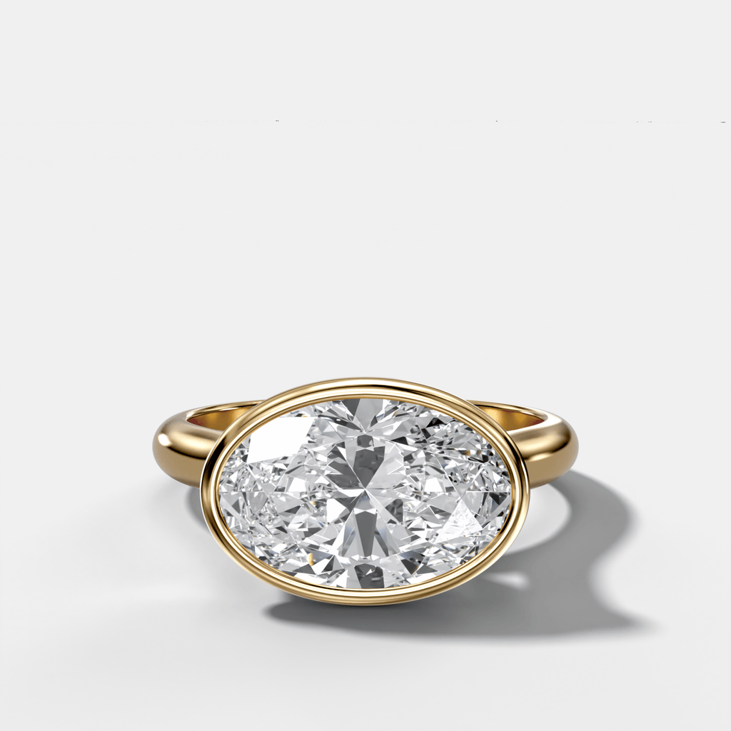 Cathedral Bezel Set Solitaire Engagement Ring With Oval Diamond (East West)
