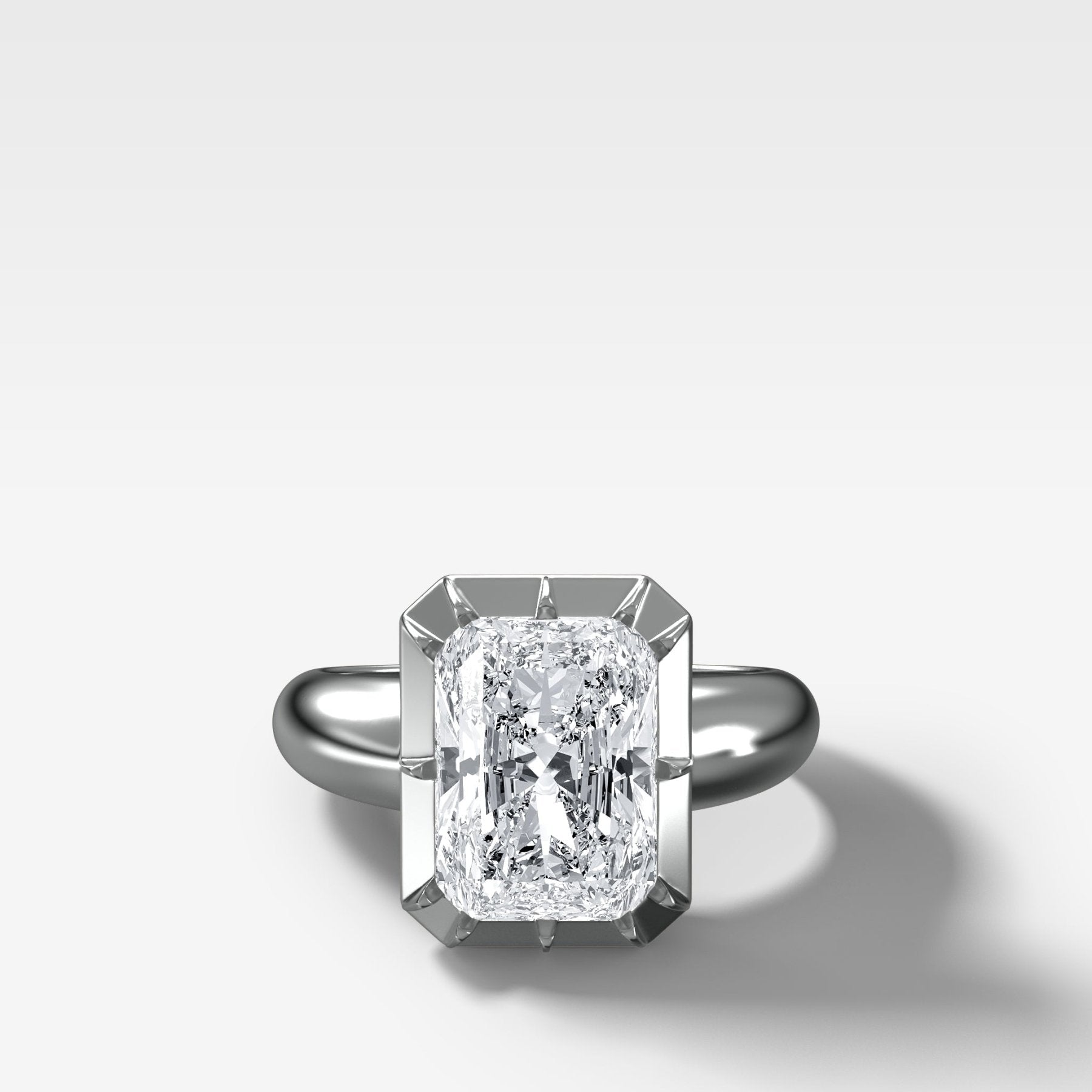 Club Button Back Engagement Ring with an Elongated Radiant Cut Diamond