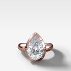 Club Button Back Engagement Ring with a Pear Cut Diamond