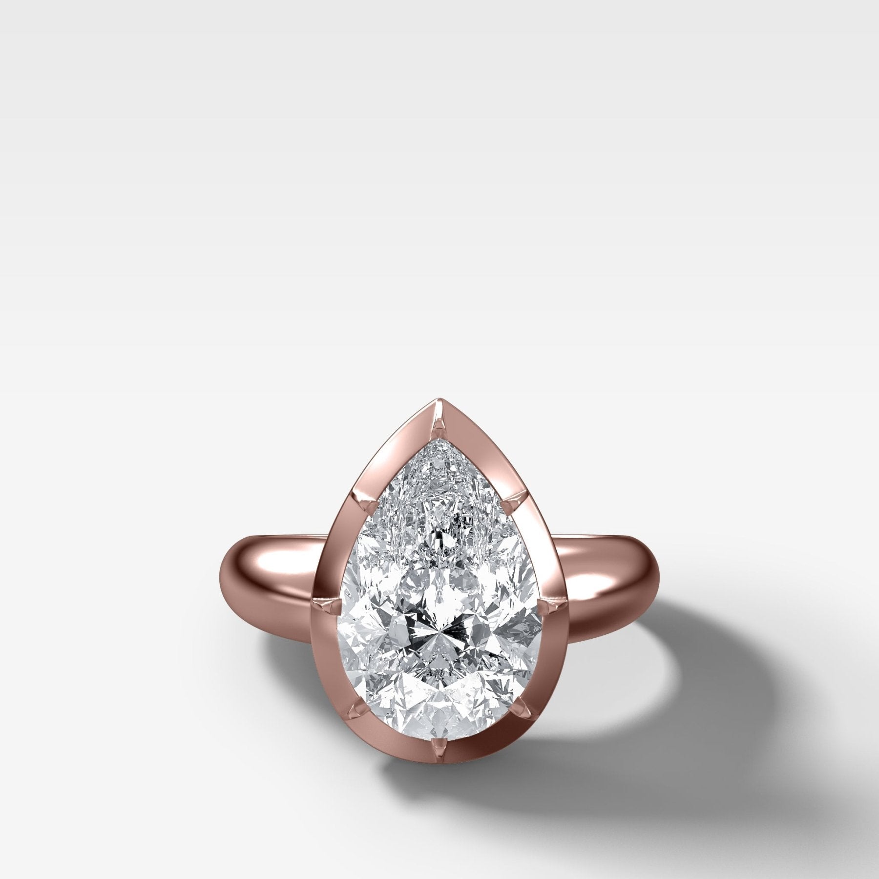 Club Button Back Engagement Ring with a Pear Cut Diamond
