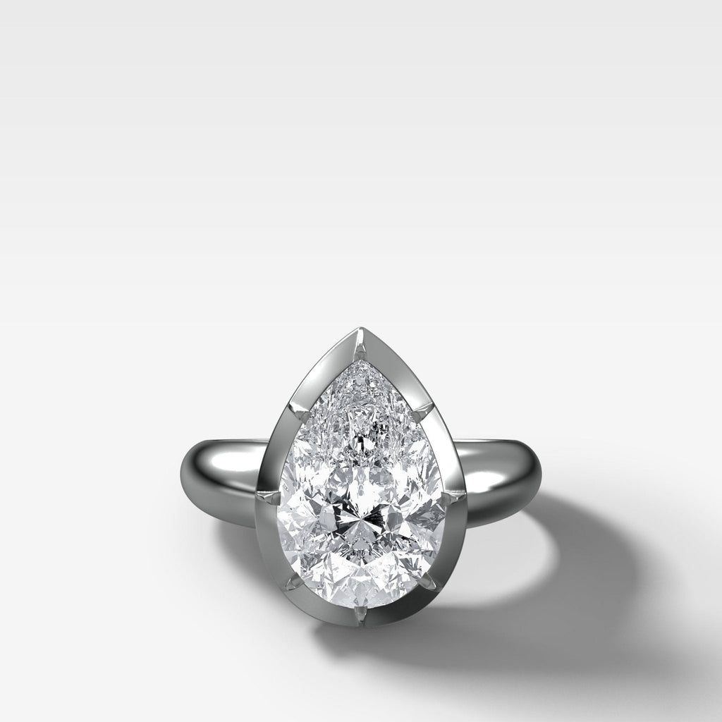 Club Button Back Engagement Ring with a Pear Cut Diamond