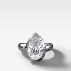 Club Button Back Engagement Ring with a Pear Cut Diamond