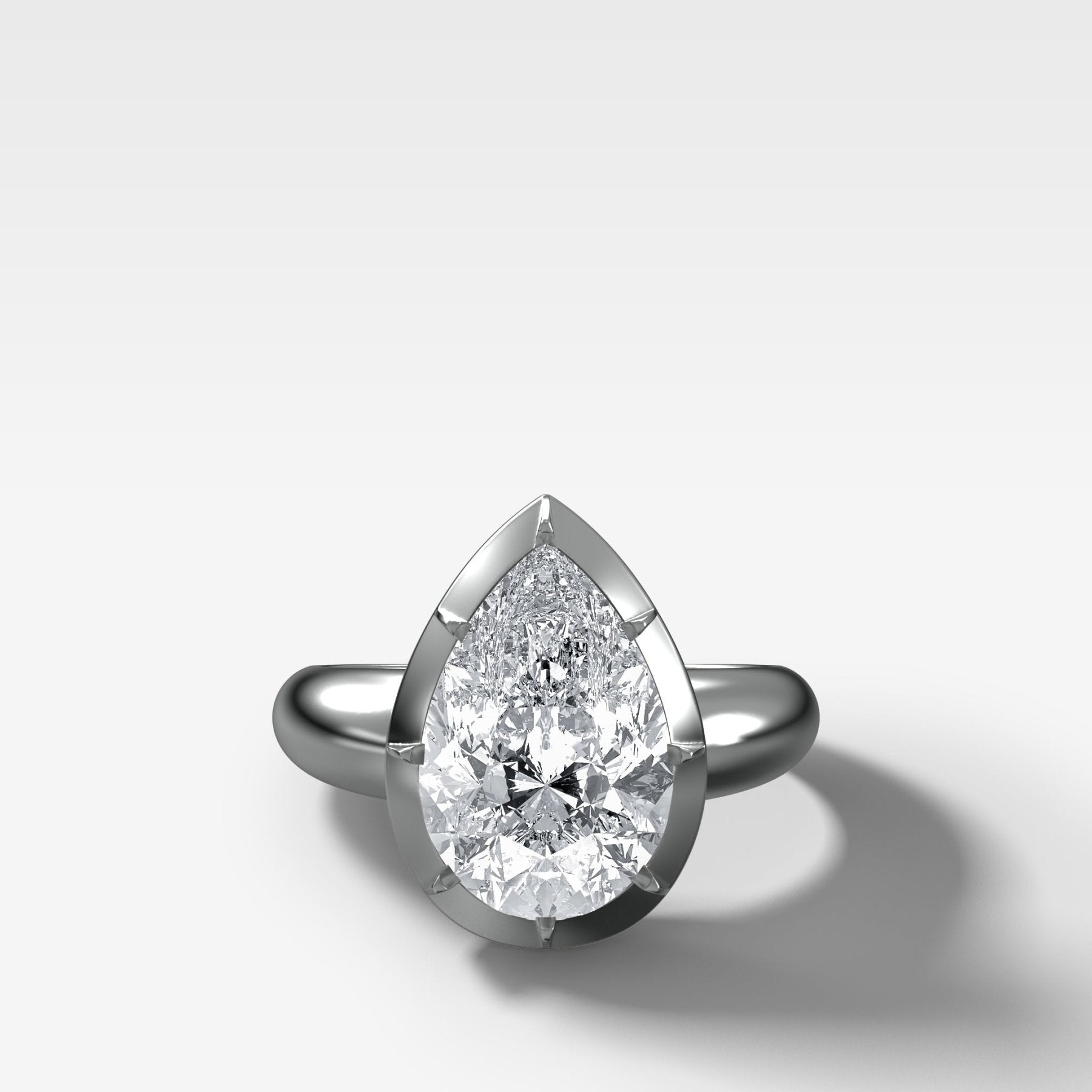 Club Button Back Engagement Ring with a Pear Cut Diamond