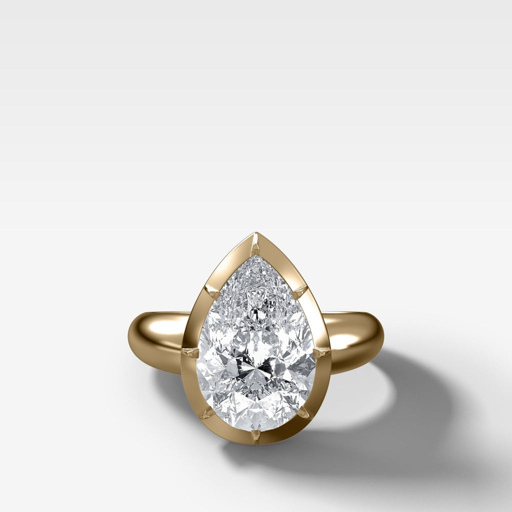 Club Button Back Engagement Ring with a Pear Cut Diamond