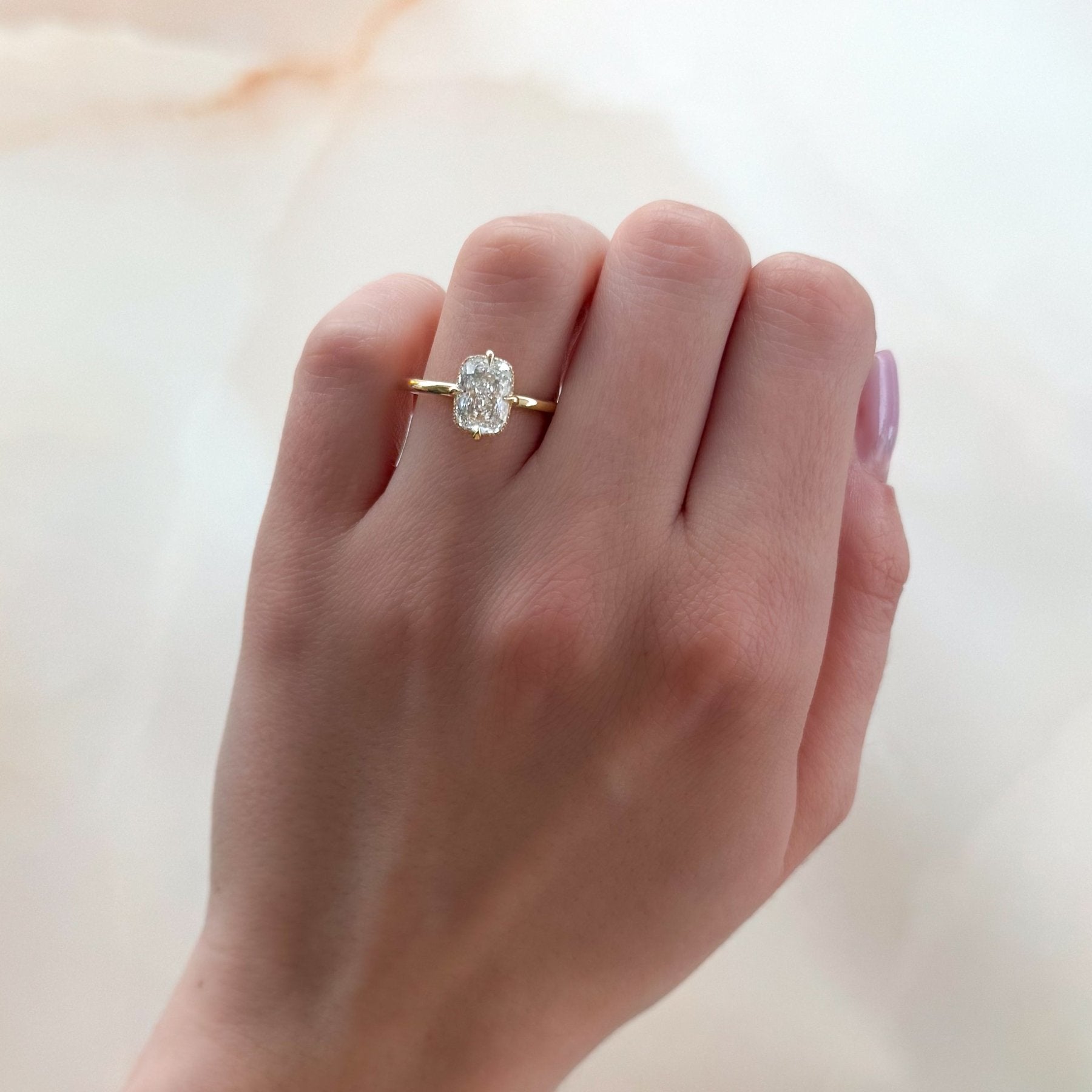 Compass Solitaire Engagement Ring with Elongated Cushion Cut Diamond