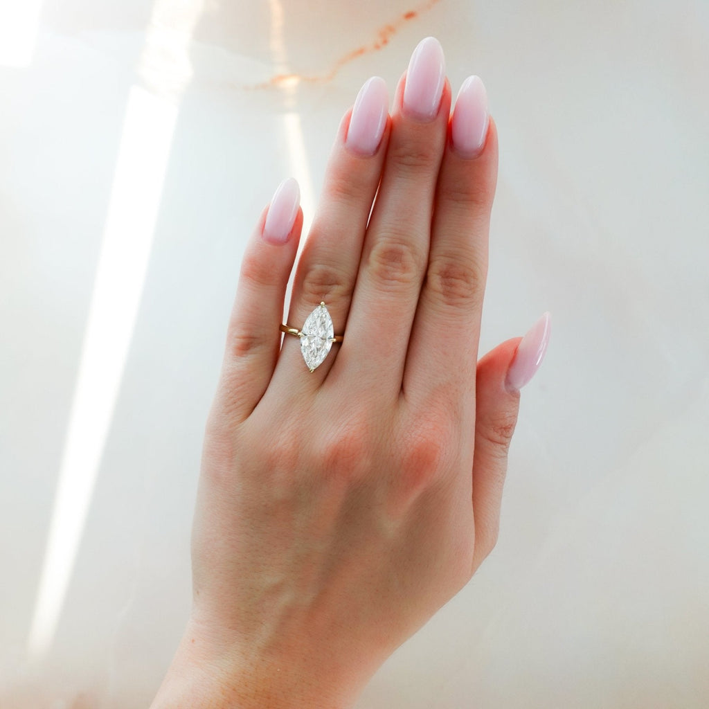 Compass Solitaire Engagement Ring with Marquise Cut Diamond (North South)