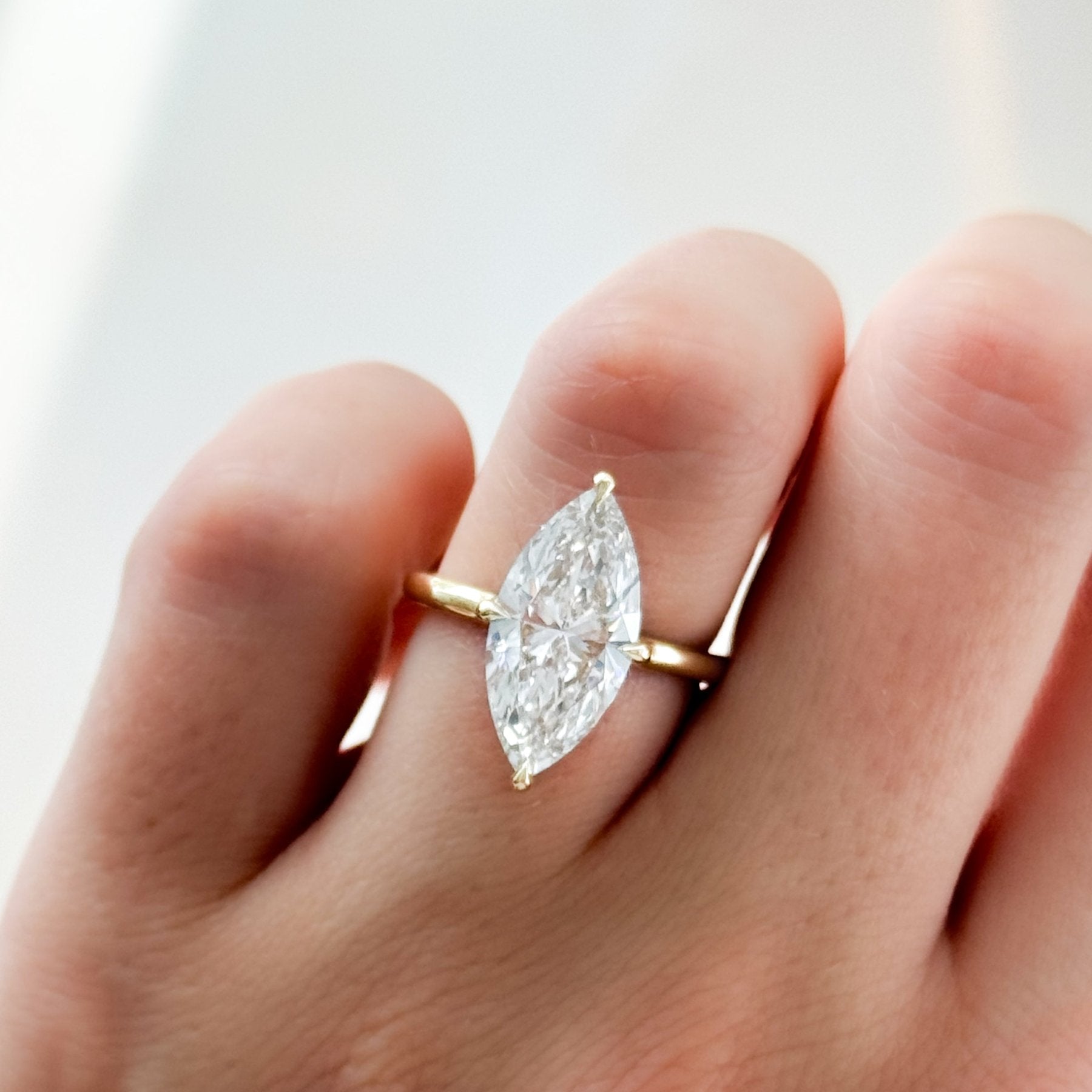 Compass Solitaire Engagement Ring with Marquise Cut Diamond (North South)