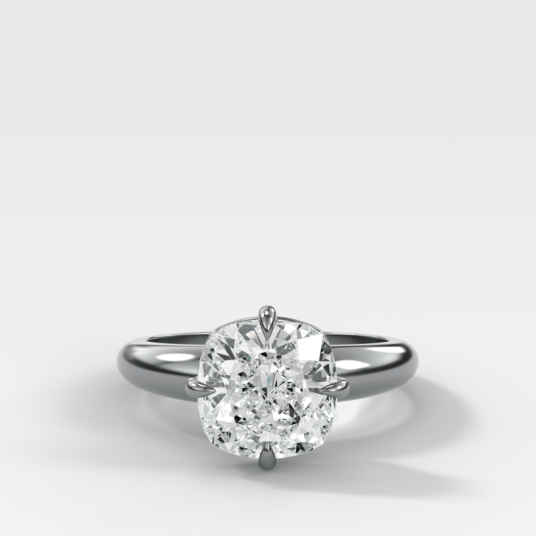 Compass Tapered Dome Engagement Ring With a Cushion Cut Diamond