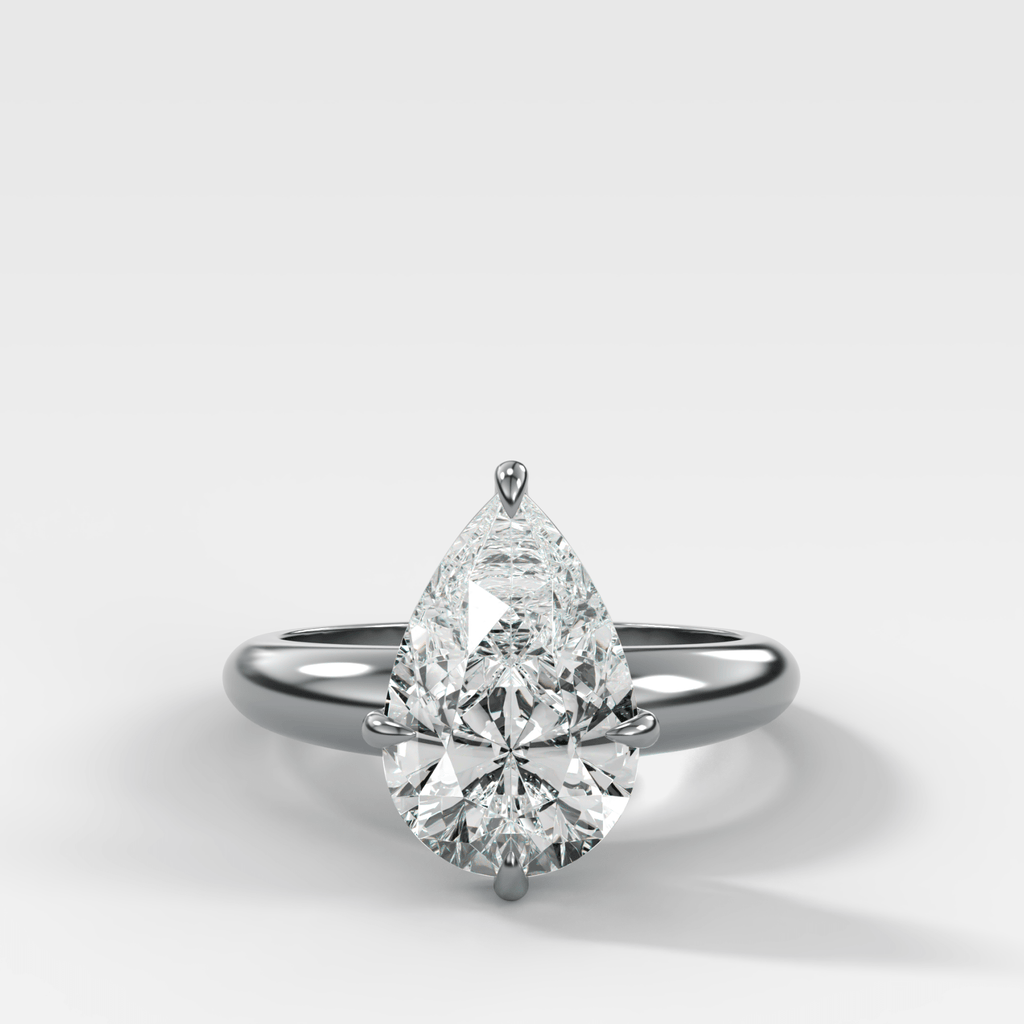 Compass Tapered Dome Engagement Ring With a Pear Diamond