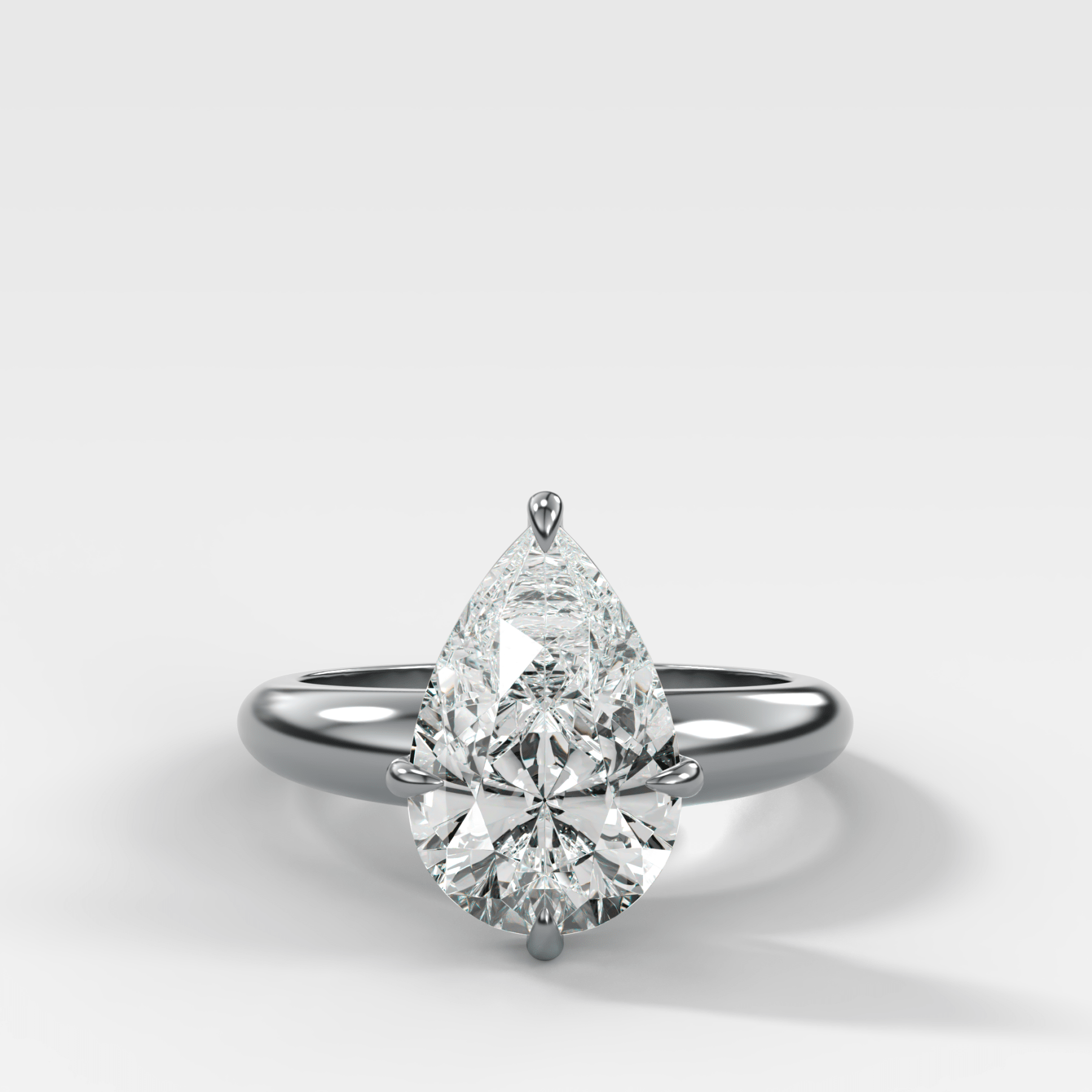 Compass Tapered Dome Engagement Ring With a Pear Diamond