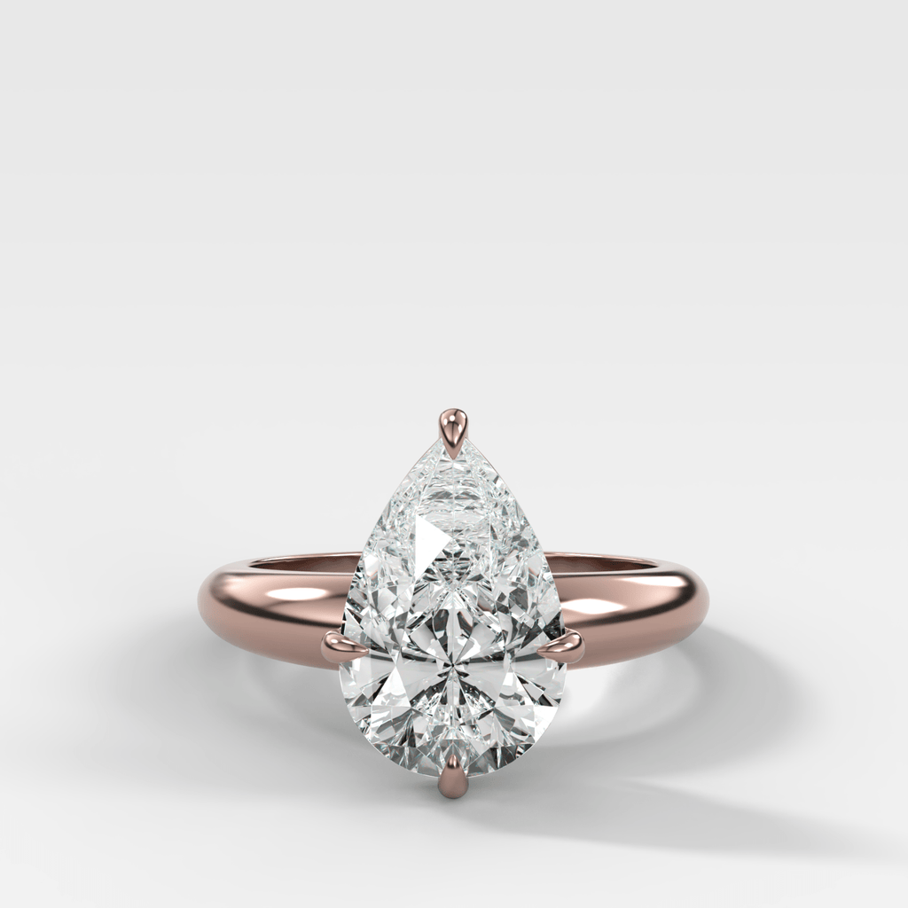 Compass Tapered Dome Engagement Ring With a Pear Diamond