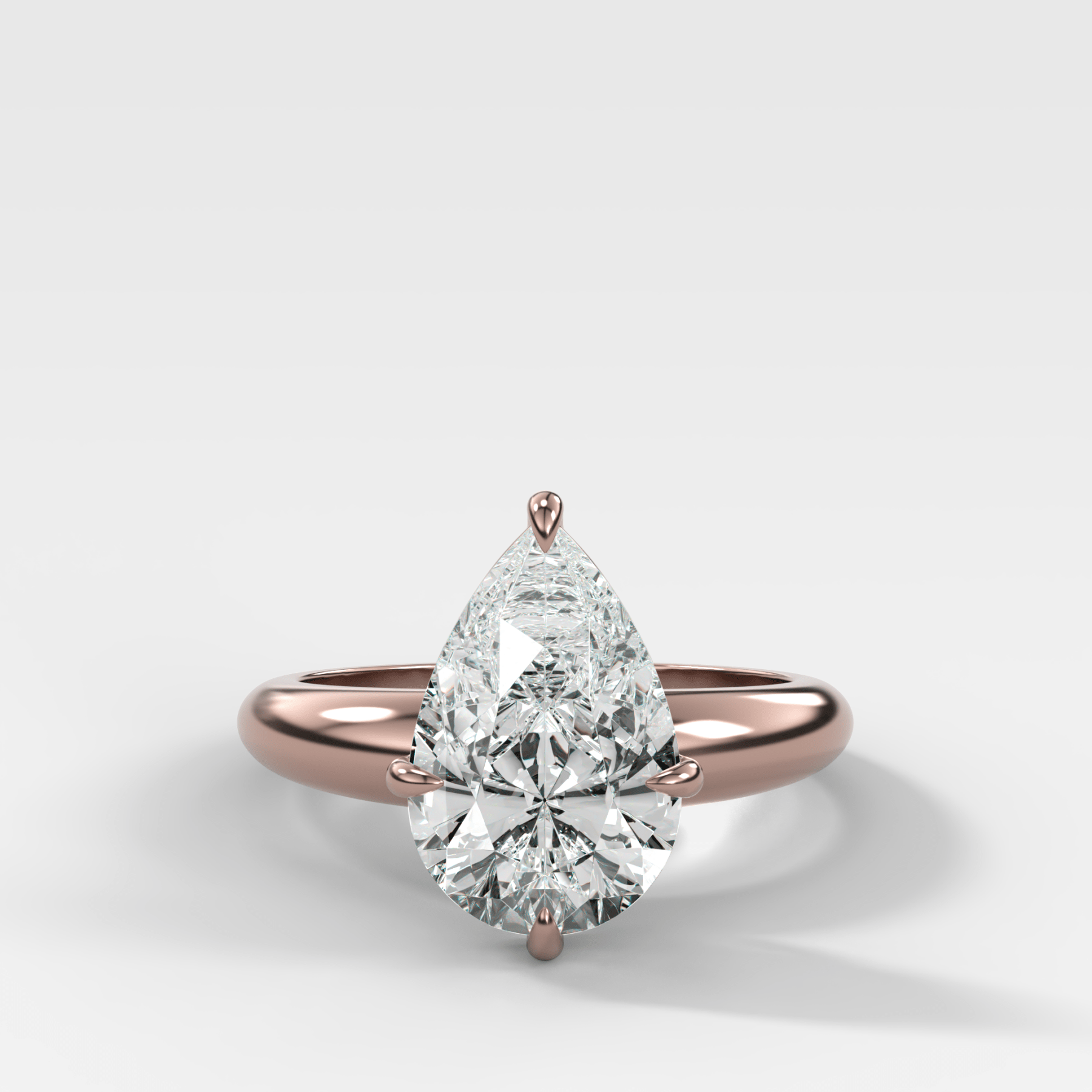 Compass Tapered Dome Engagement Ring With a Pear Diamond