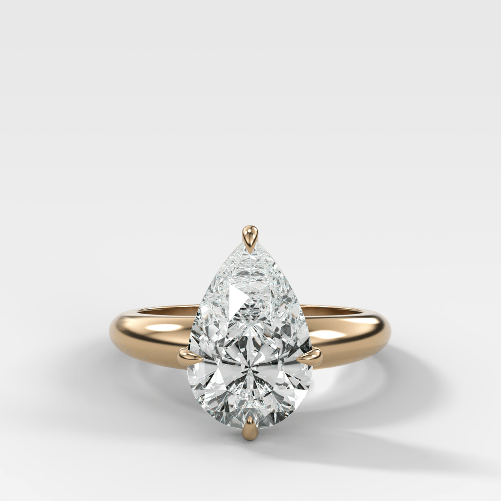 Compass Tapered Dome Engagement Ring With a Pear Diamond