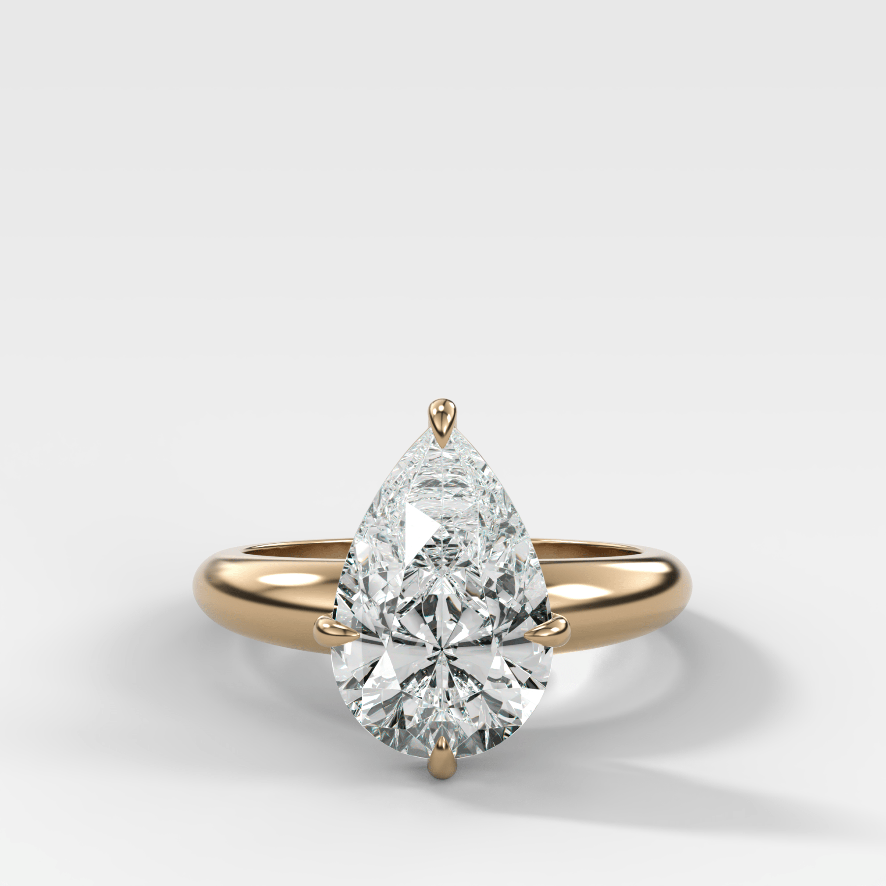 Compass Tapered Dome Engagement Ring With a Pear Diamond