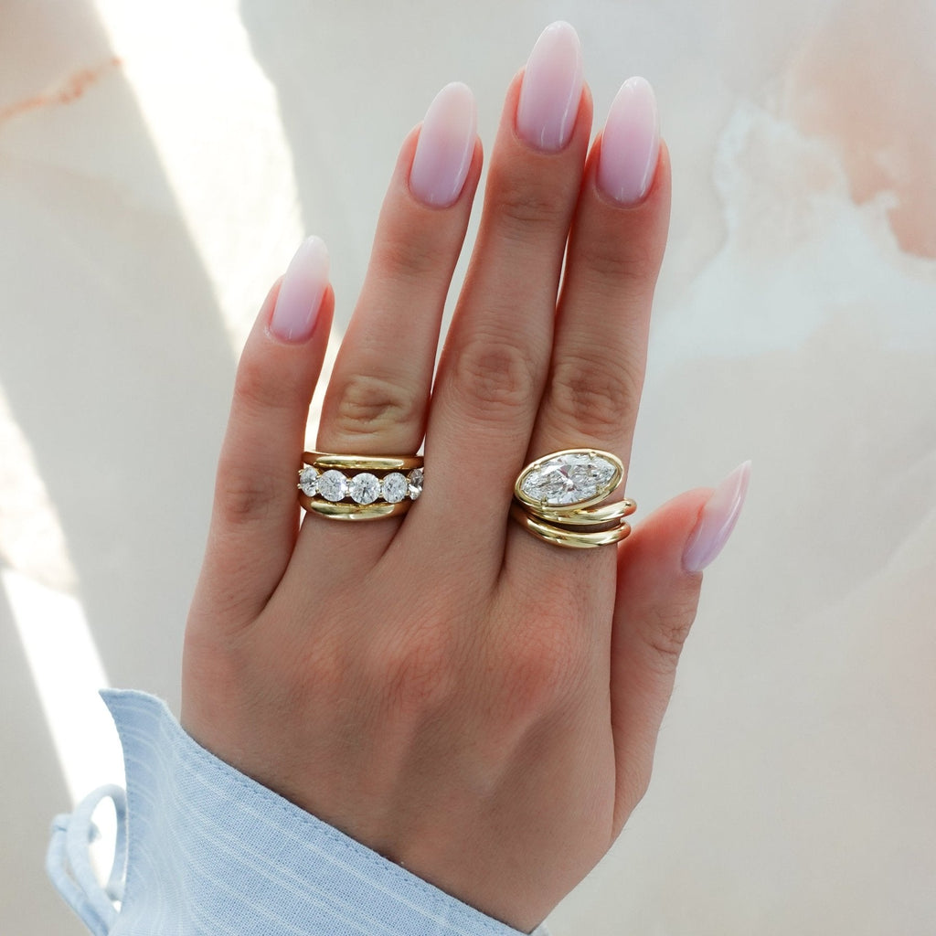 Contoured Club Engagement Ring with a Marquise Cut Diamond