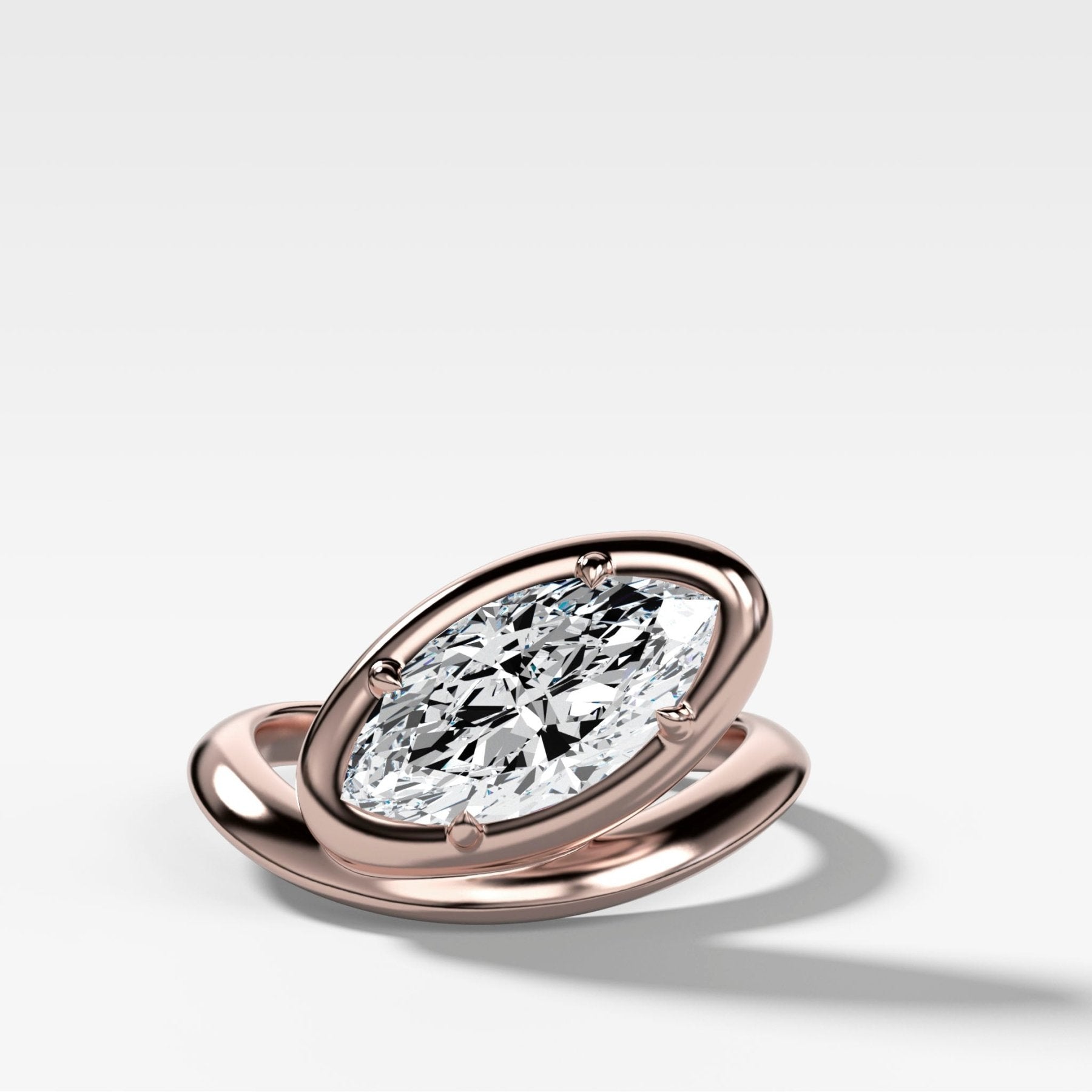 Contoured Club Engagement Ring with a Marquise Cut Diamond