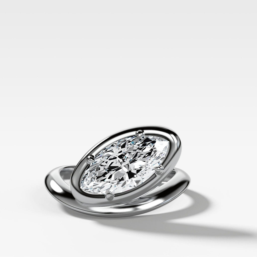 Contoured Club Engagement Ring with a Marquise Cut Diamond