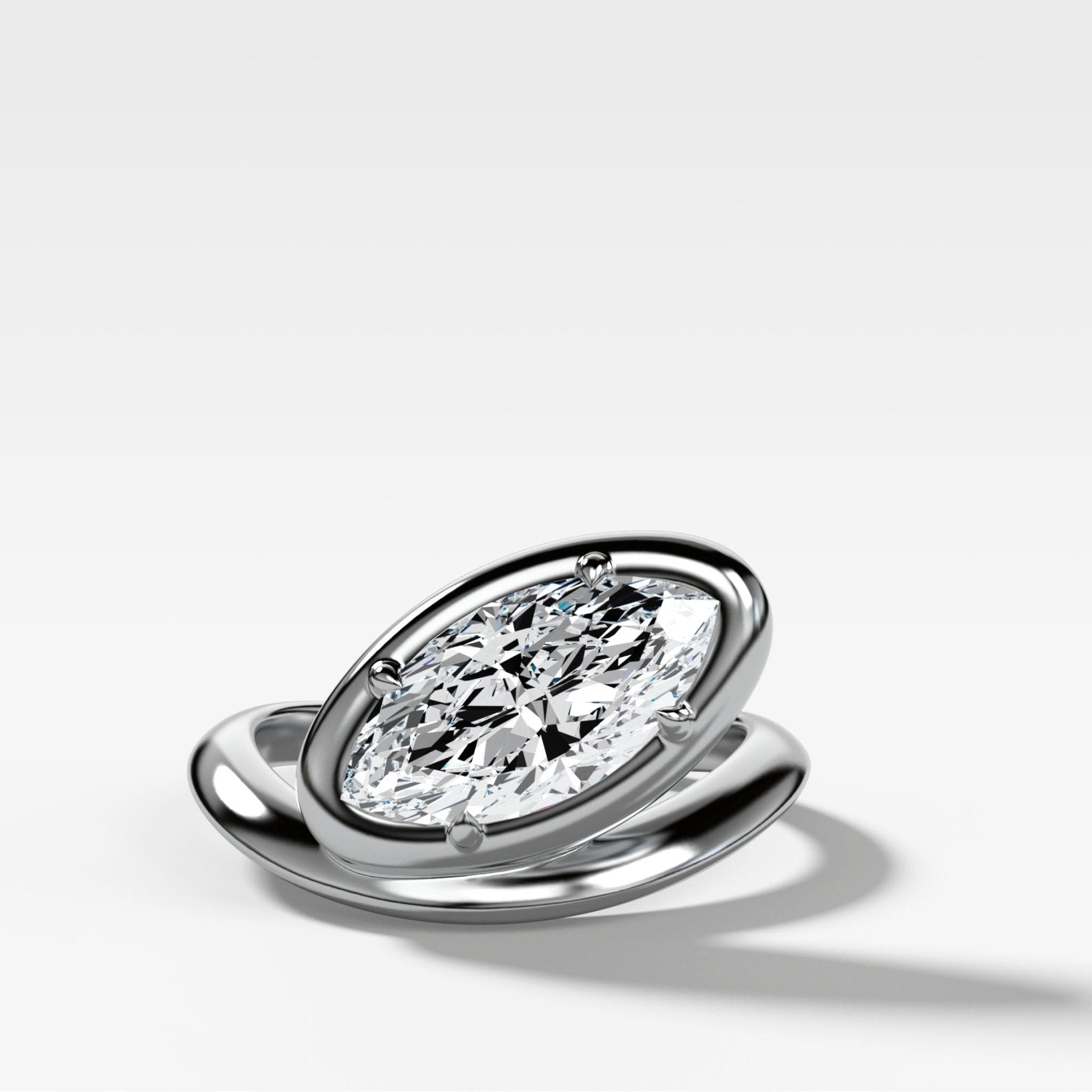 Contoured Club Engagement Ring with a Marquise Cut Diamond