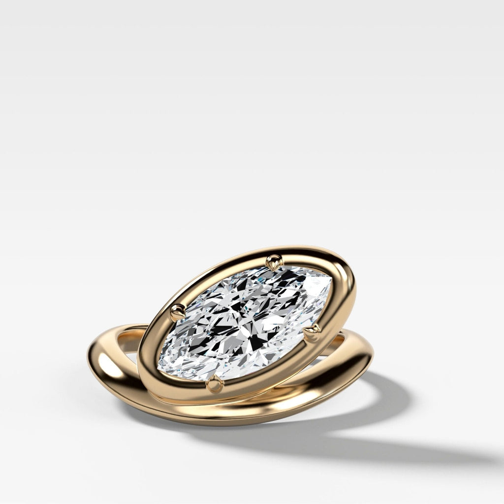 Contoured Club Engagement Ring with a Marquise Cut Diamond