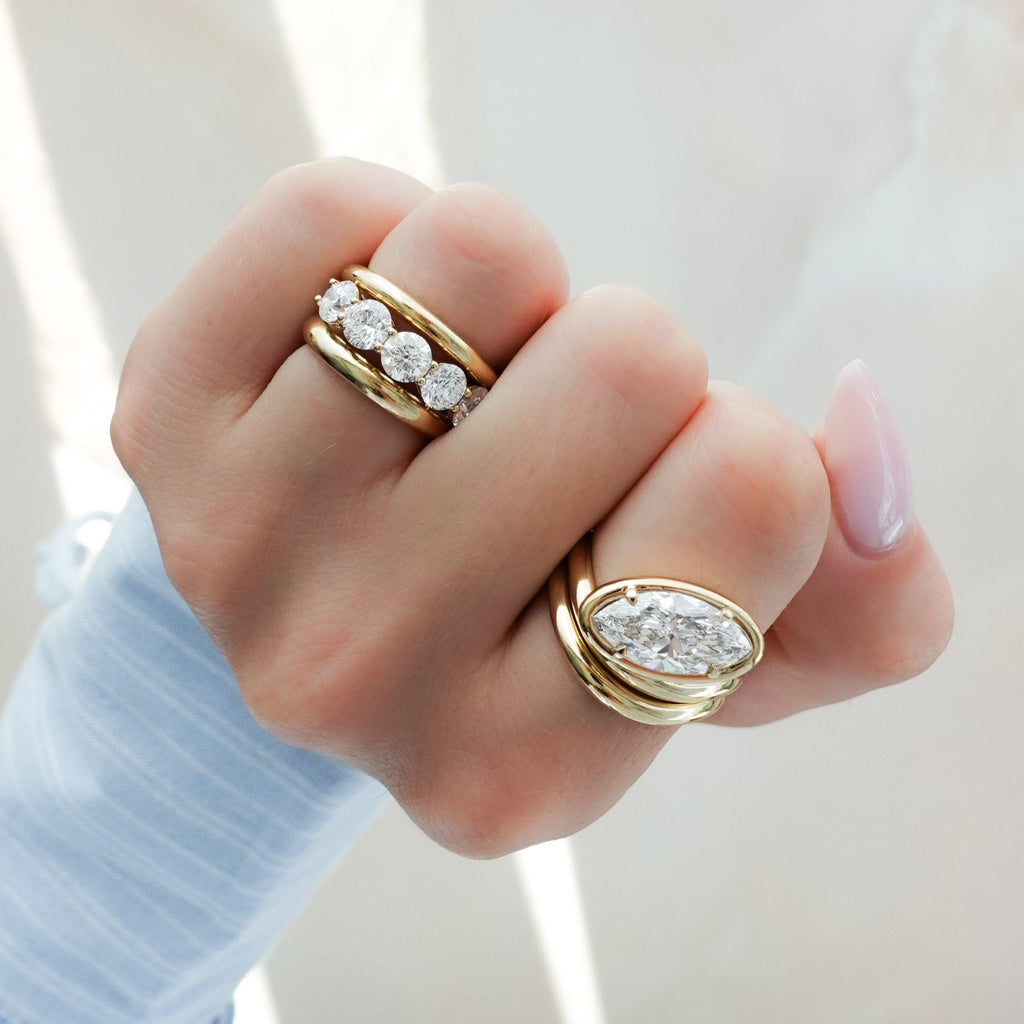 Contoured Club Engagement Ring with a Marquise Cut Diamond