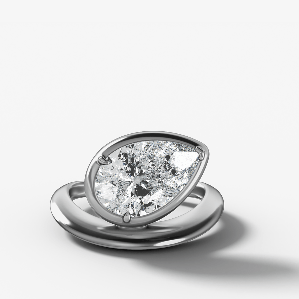 Contoured Club Engagement Ring with a Pear Cut Diamond