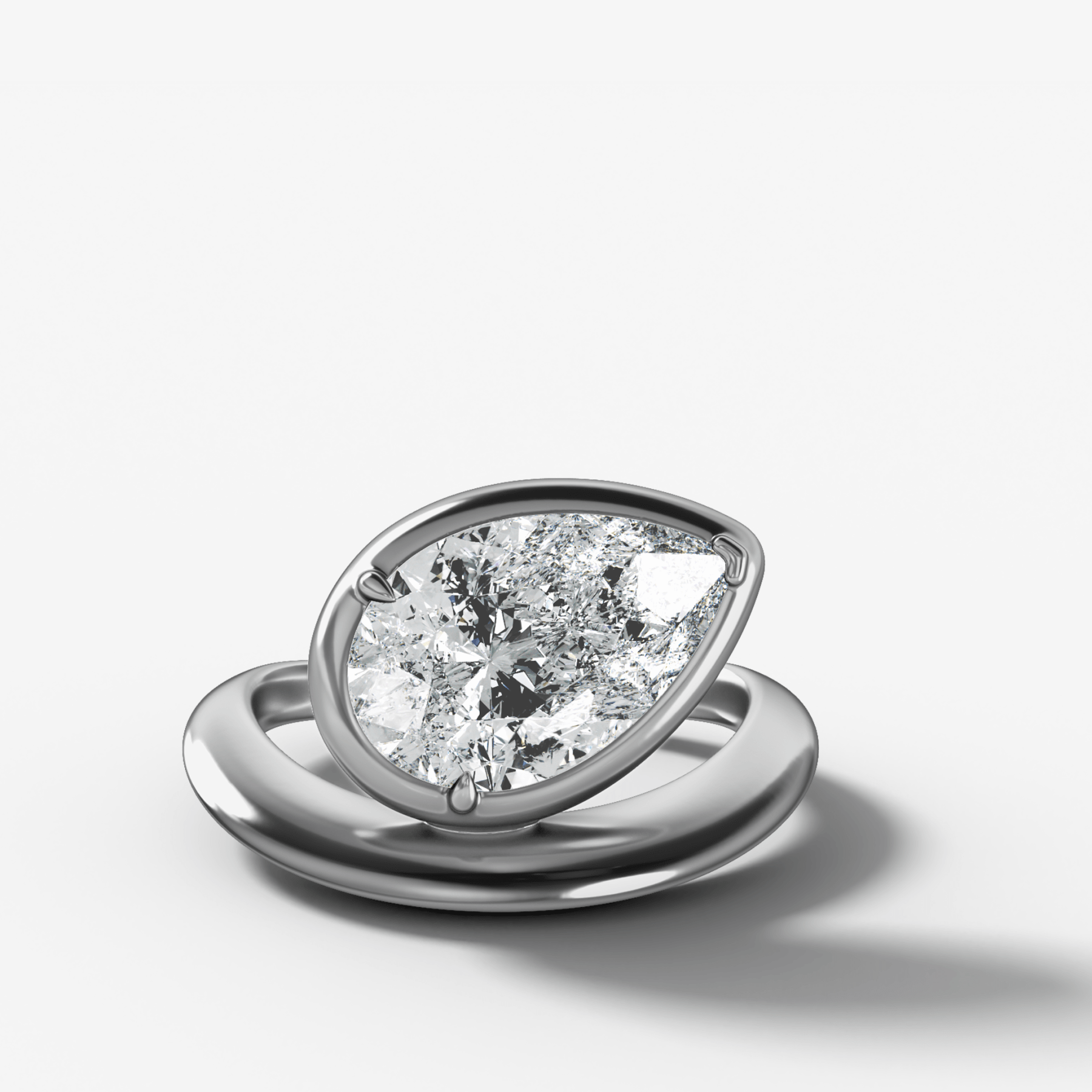 Contoured Club Engagement Ring with a Pear Cut Diamond