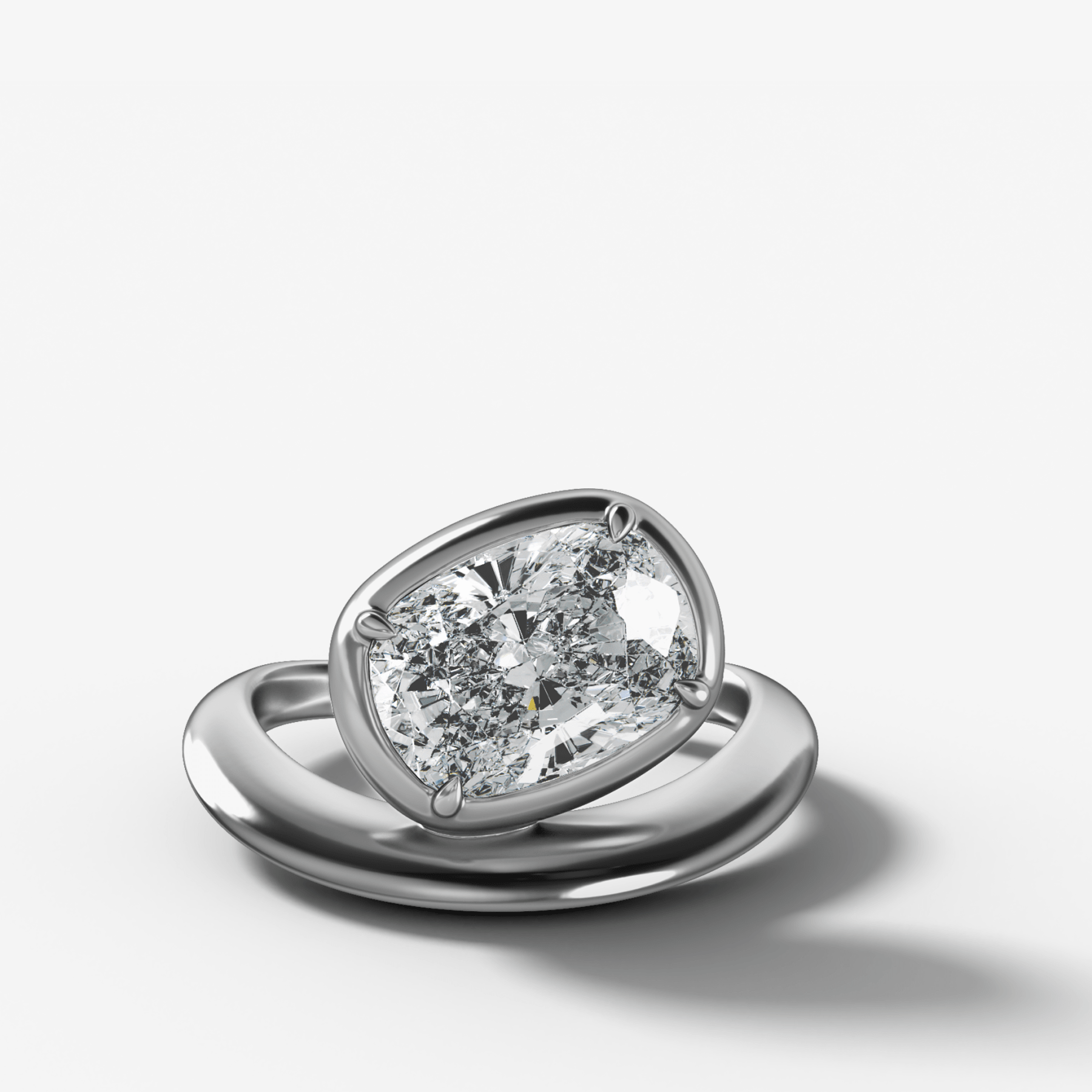 Contoured Club Engagement Ring with an Elongated Cushion Cut Diamond