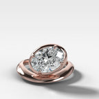 Contoured Club Engagement Ring with an Oval Cut Diamond