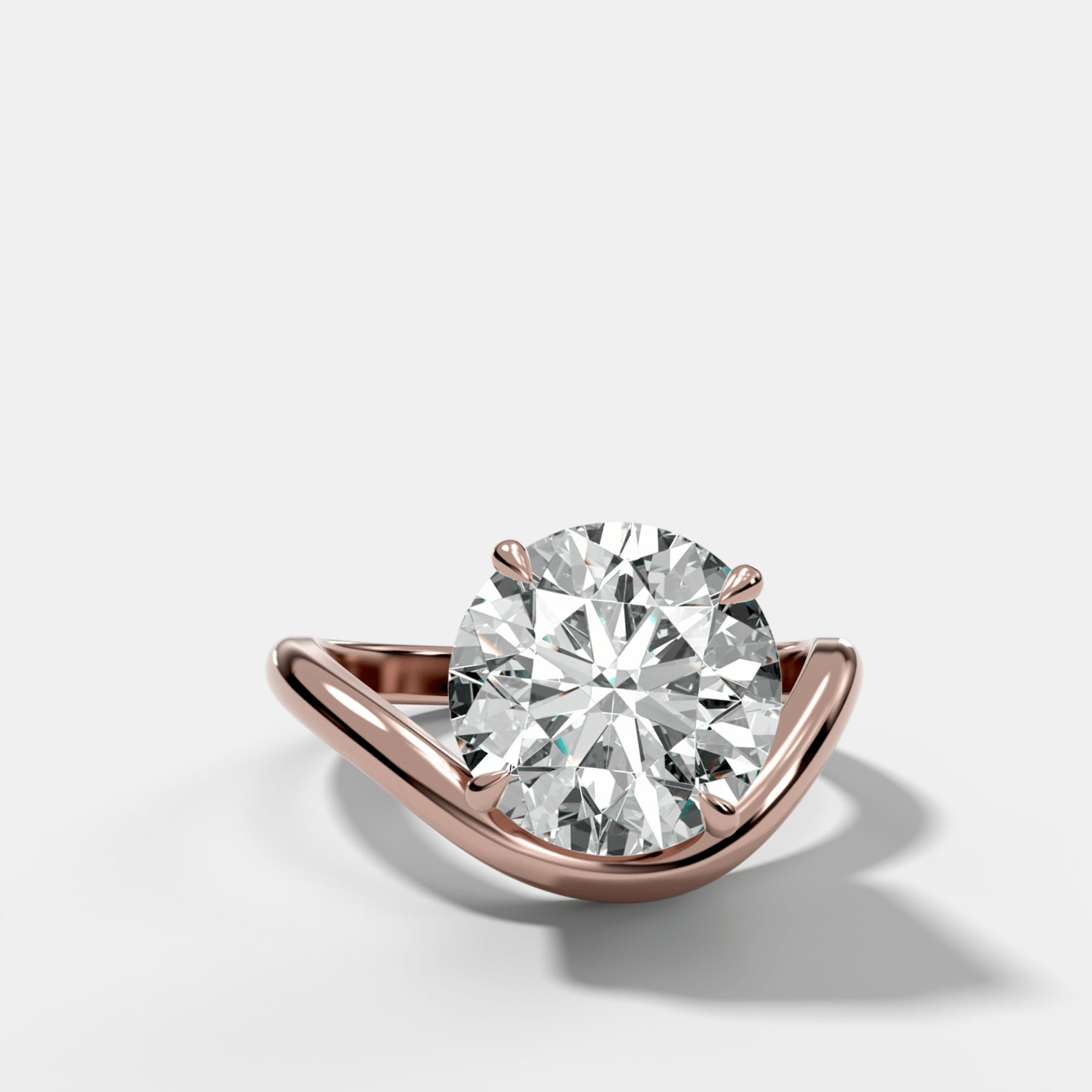 Contoured Engagement Ring with a Round Cut Diamond