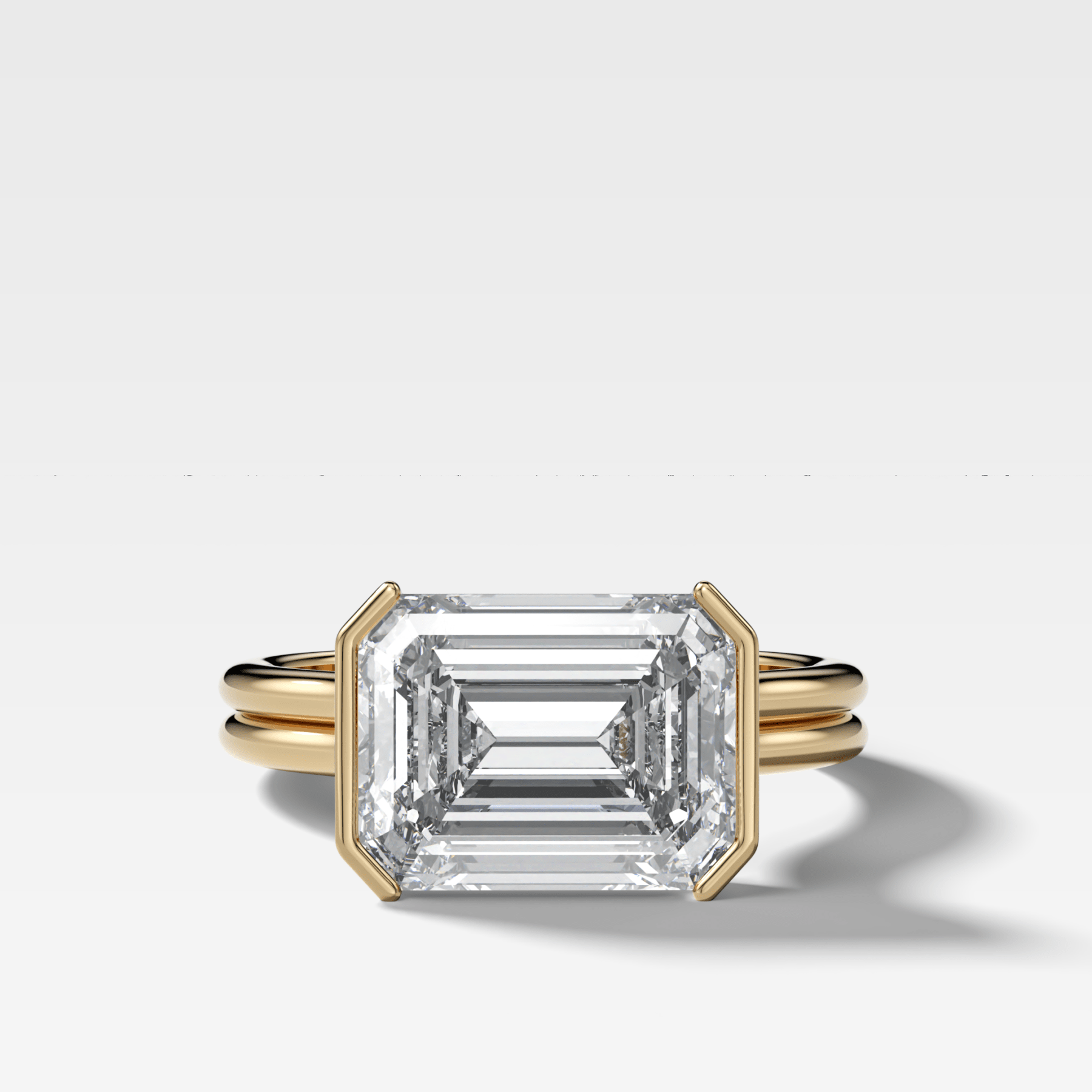 Double Row East West Half Bezel Solitaire Engagement Ring With Emerald Cut Diamond