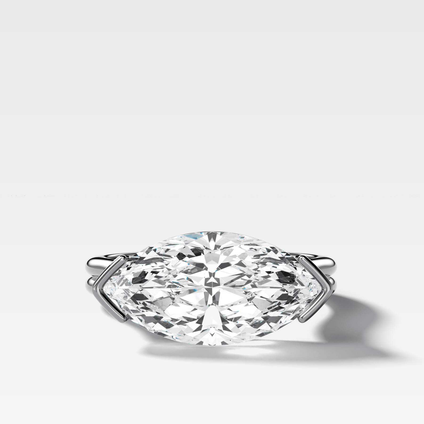 Double Row East West Half Bezel Solitaire Engagement Ring With Marquise Cut Diamond