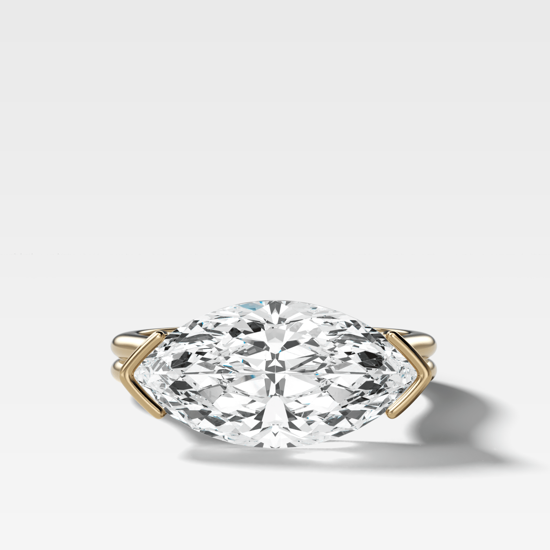Double Row East West Half Bezel Solitaire Engagement Ring With Marquise Cut Diamond