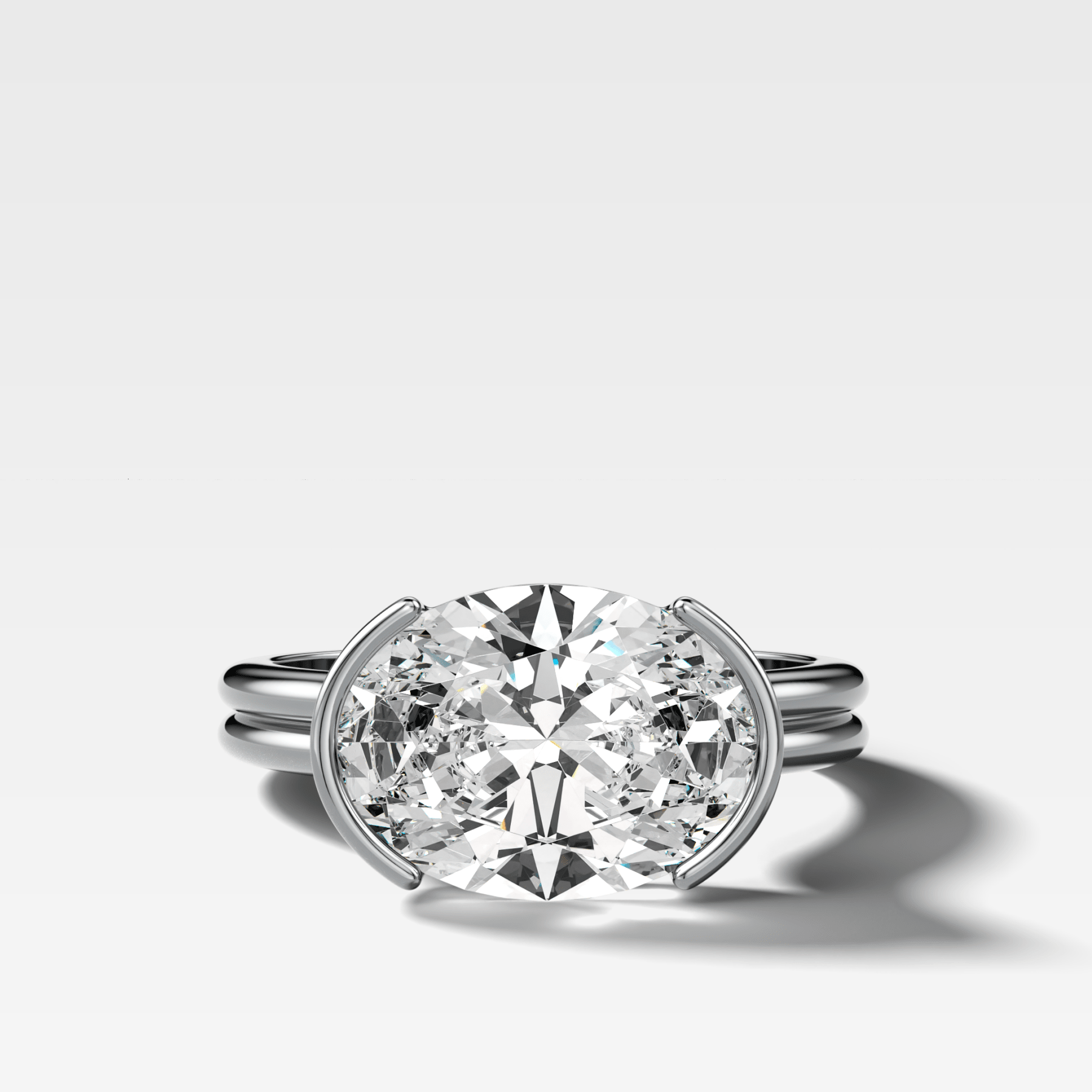 Double Row East West Half Bezel Solitaire Engagement Ring With Oval Cut Diamond