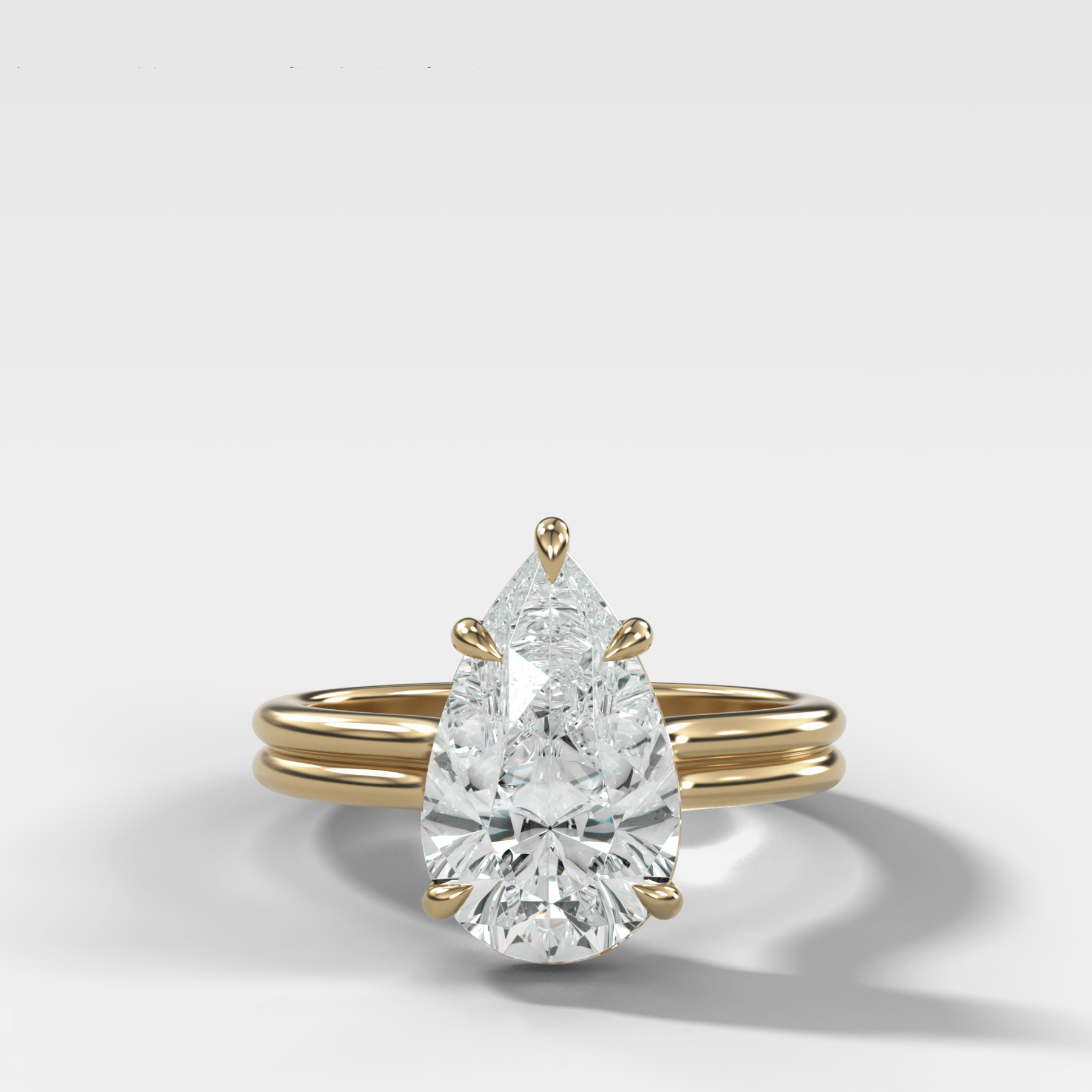 Double Row Solitaire Engagement Ring With Pear Cut Diamond