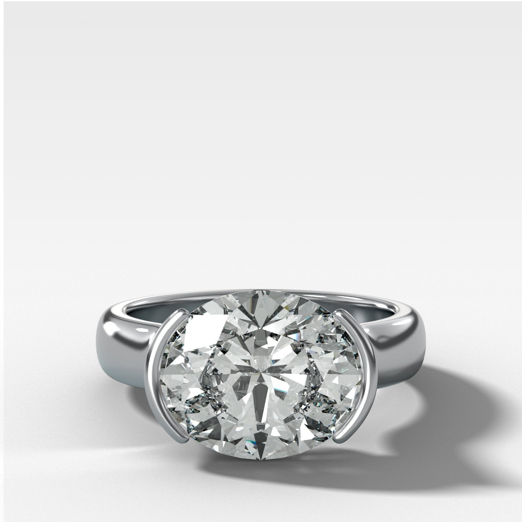 East West Half Bezel 4mm Solitaire Engagement Ring With Oval Cut Diamond