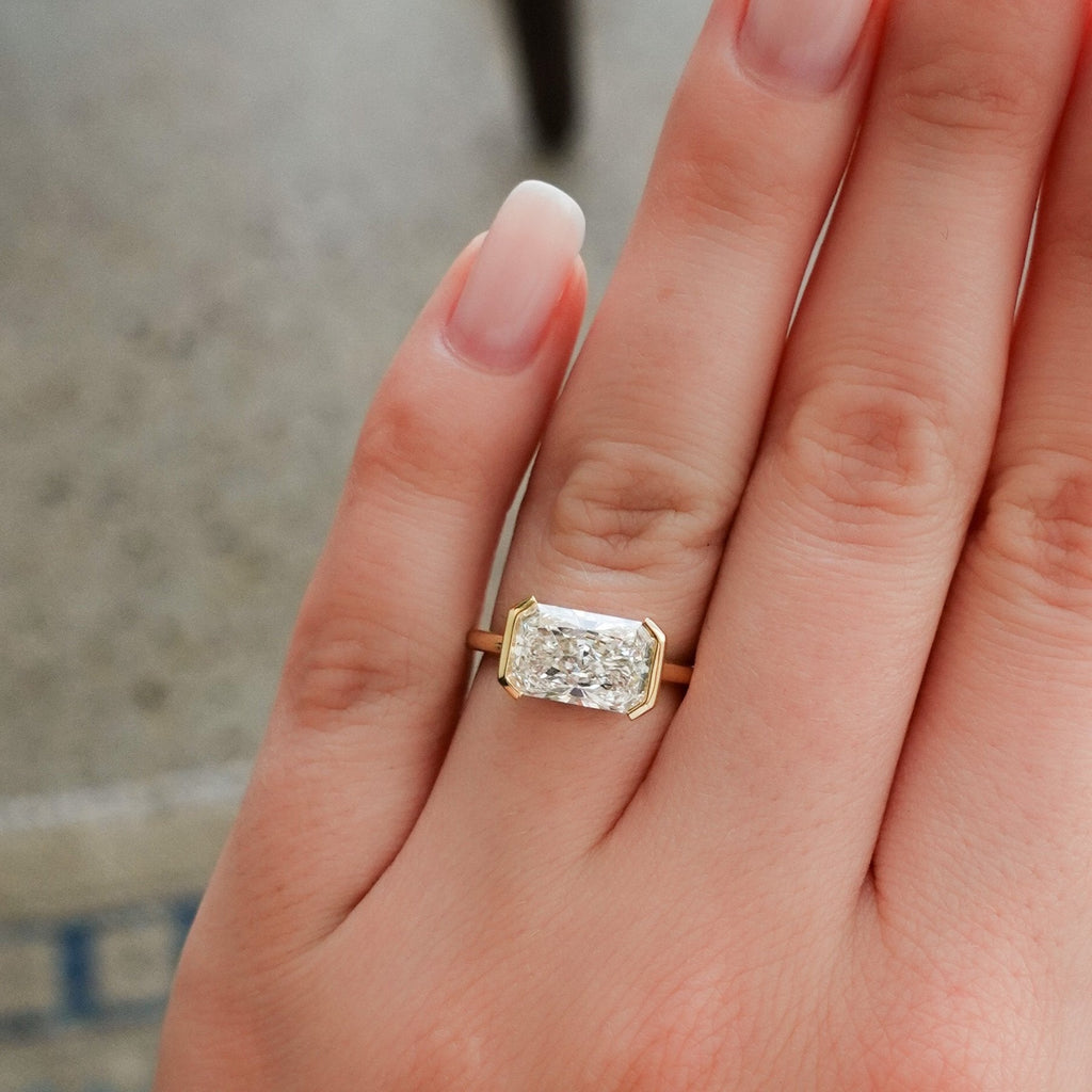 East West Half Bezel Solitaire Engagement Ring With 4.07ct Radiant Cut Lab Grown Diamond
