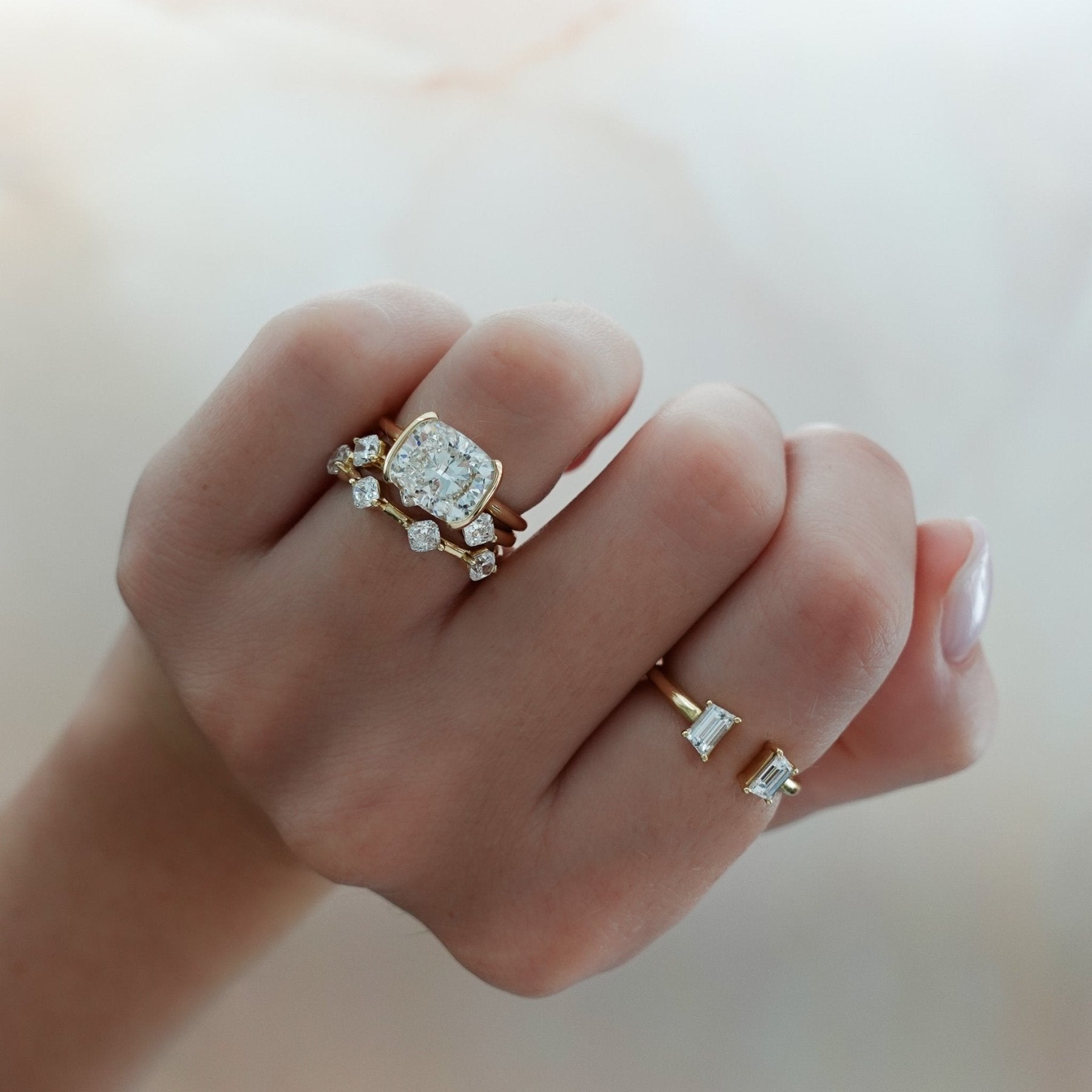 East West Half Bezel Solitaire Engagement Ring With Elongated Cushion Cut Diamond