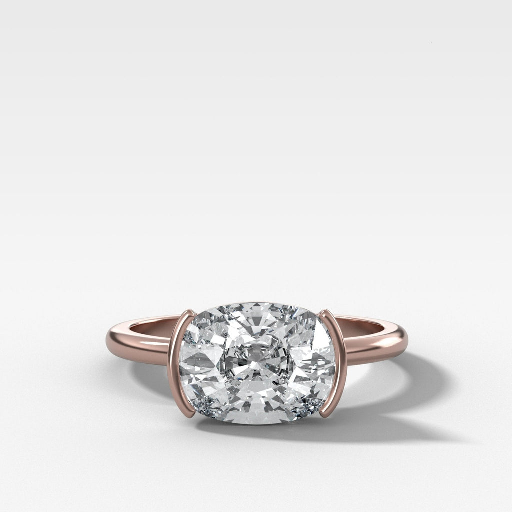 East West Half Bezel Solitaire Engagement Ring With Elongated Cushion Cut Diamond